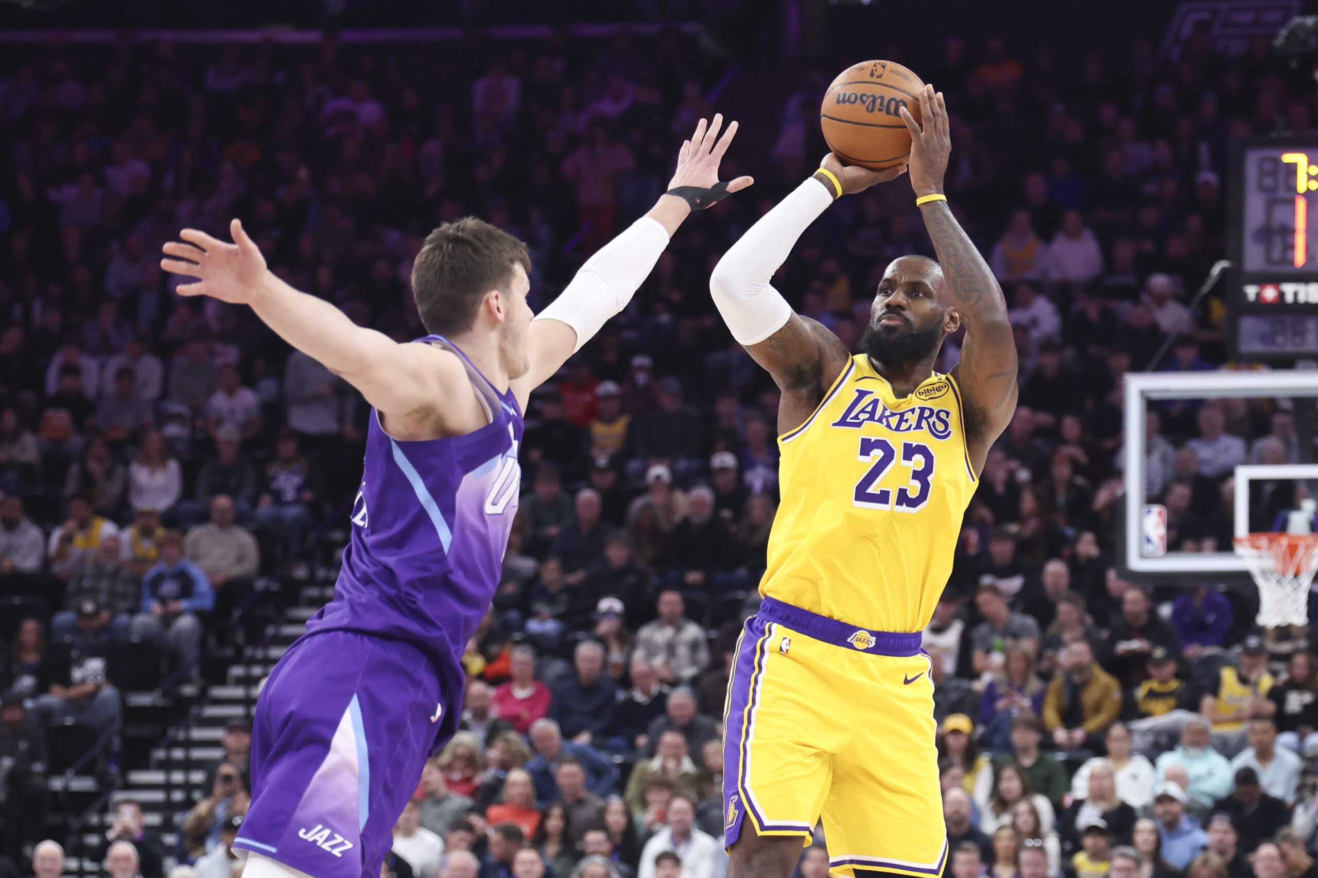 Lakers forward LeBron James (23) shoots over Utah Jazz center...