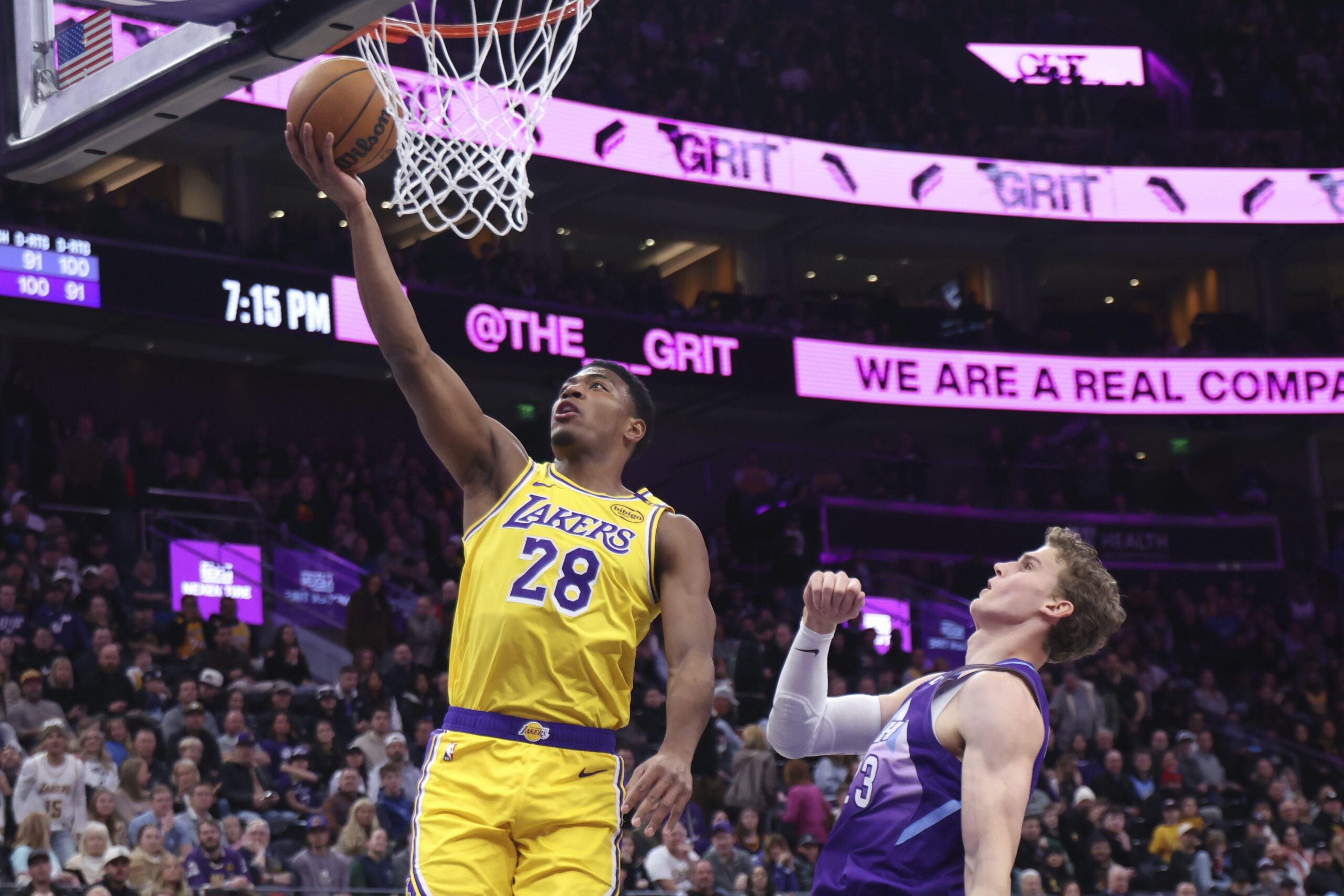 Lakers forward Rui Hachimura (28) lays the ball up against...