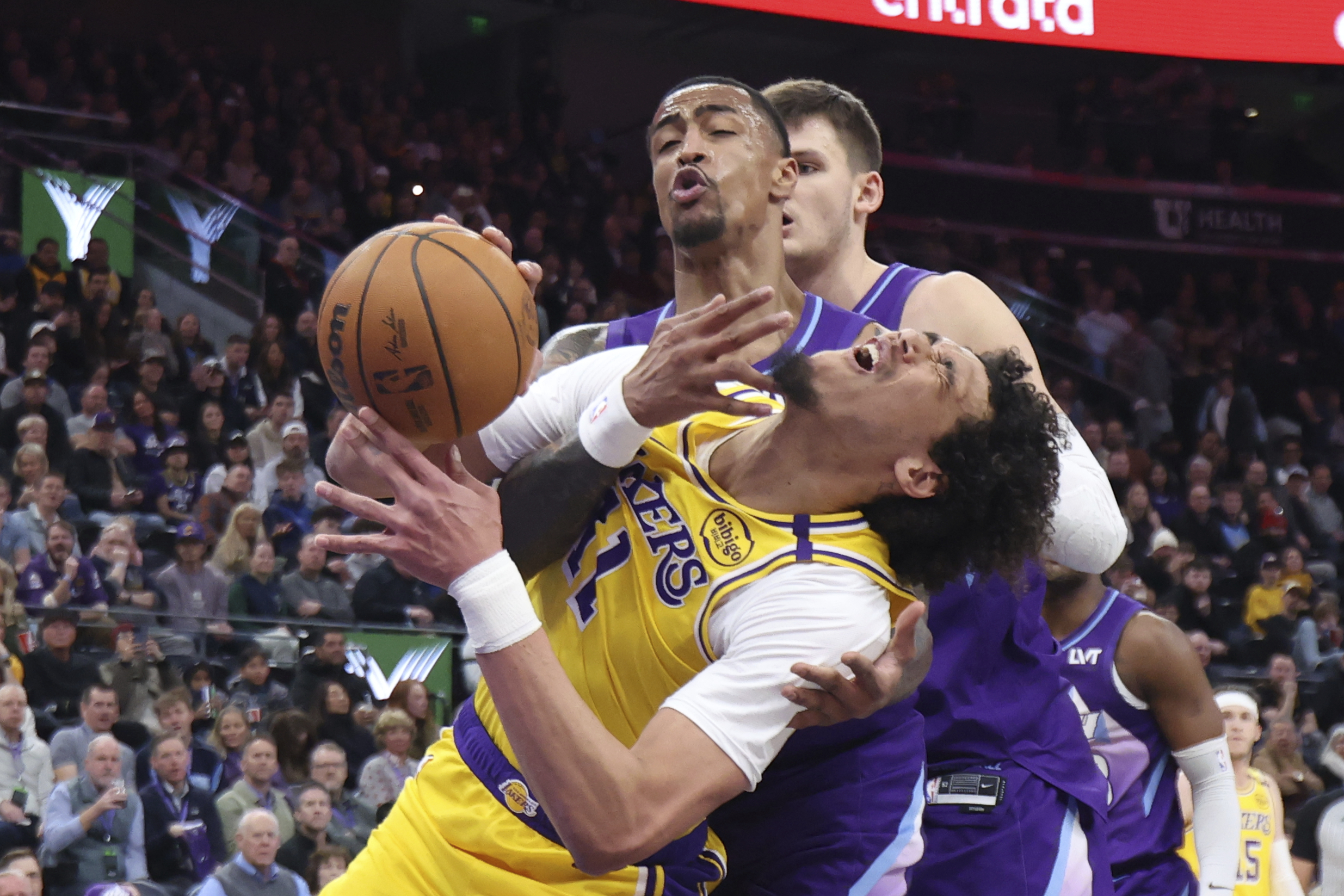 Lakers center Jaxson Hayes (11) is fouled by Utah Jazz...