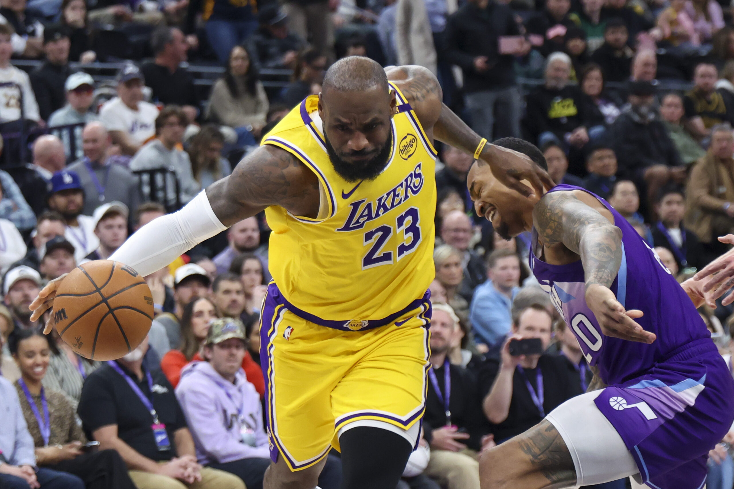 Lakers forward LeBron James (23) drives against Utah Jazz forward...