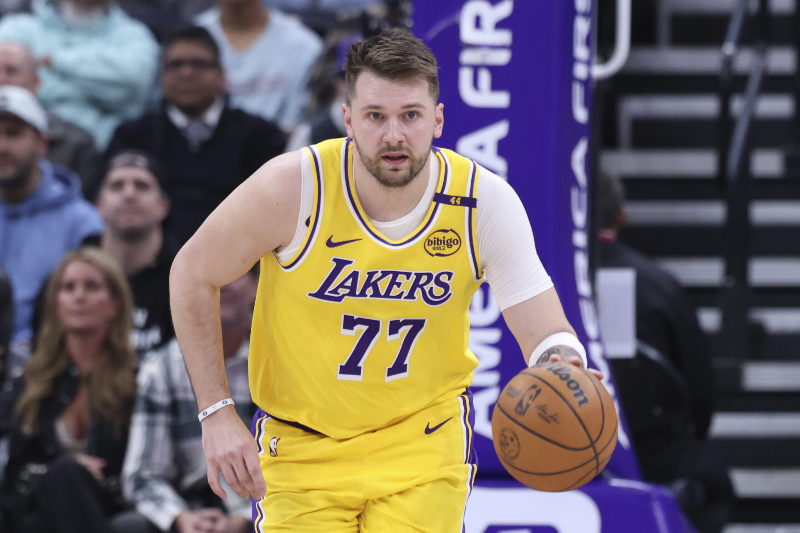 Lakers guard Luka Doncic brings the ball up the court...