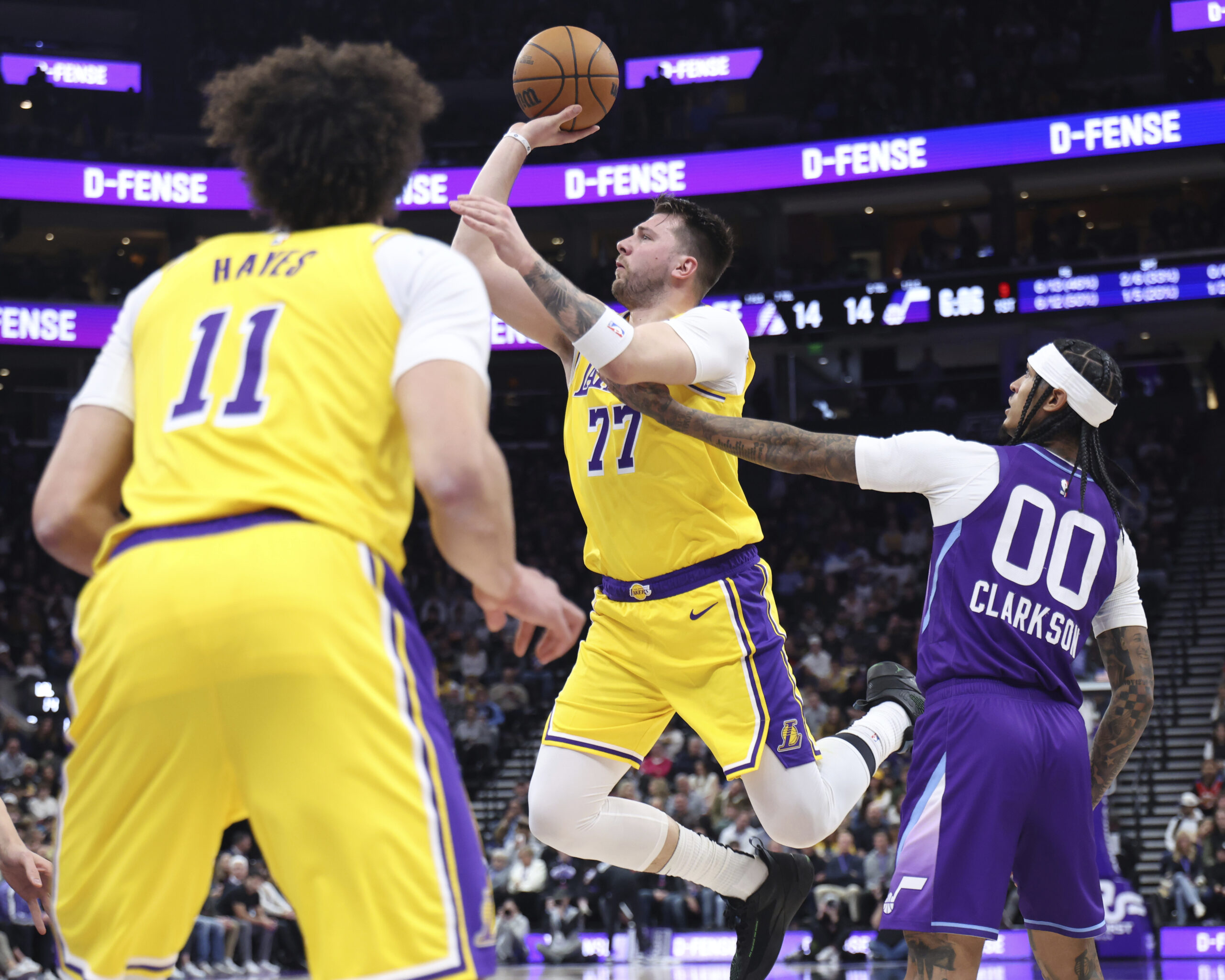 Lakers guard Luka Doncic (77) shoots as Utah Jazz guard...