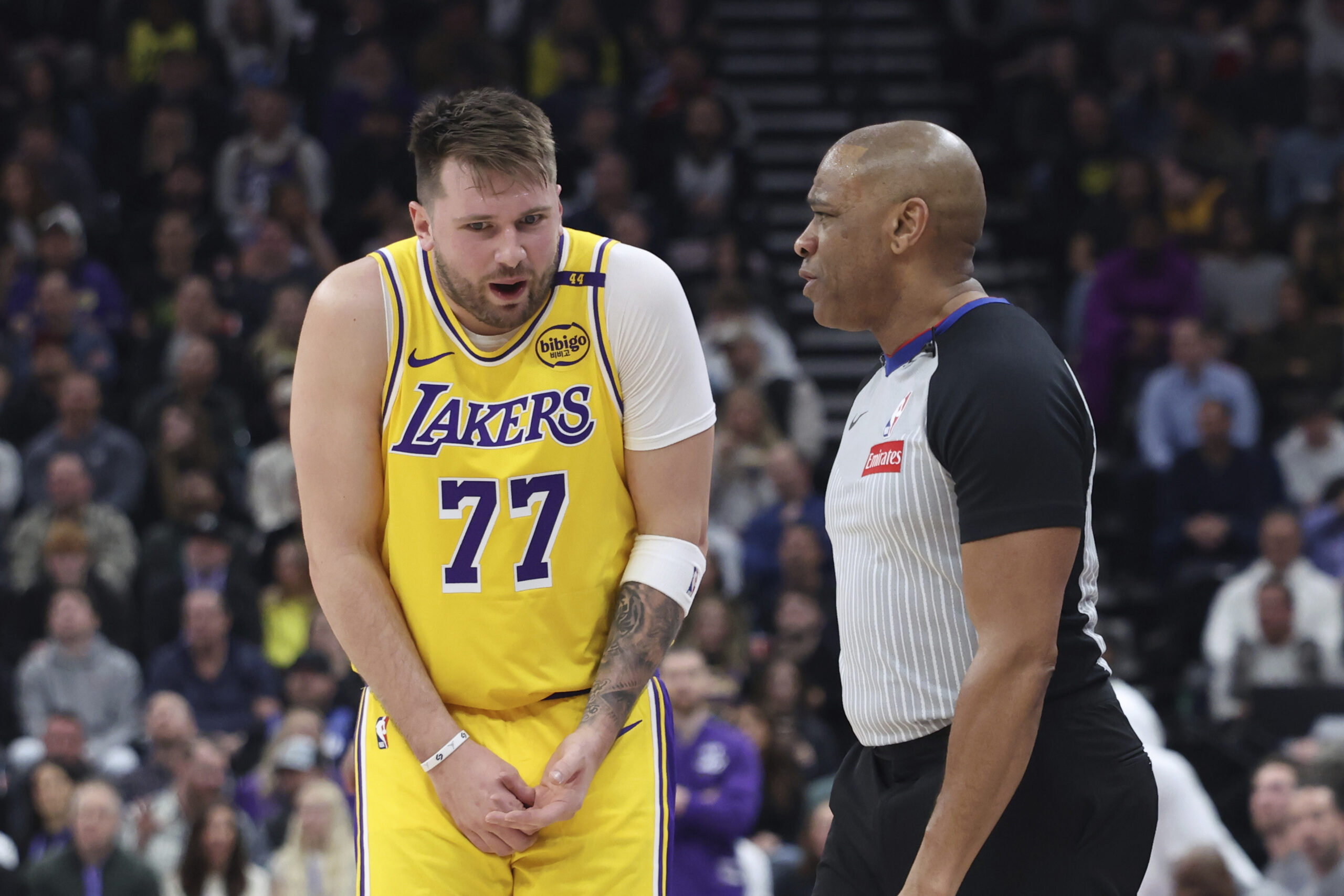 Lakers guard Luka Doncic (speaks with referee Tre Maddox about...