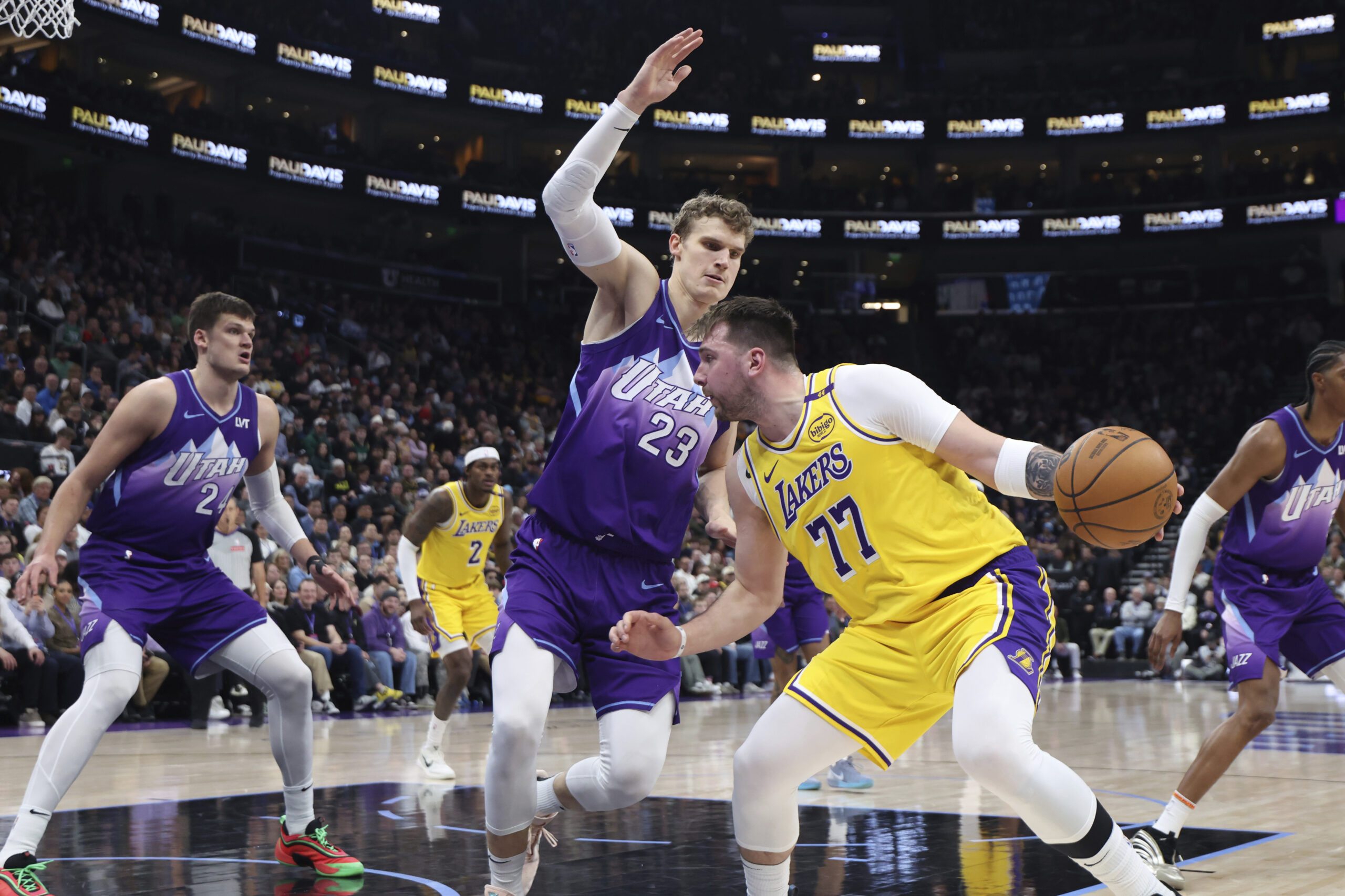 Lakers guard Luka Doncic (77) drives against Utah Jazz forward...