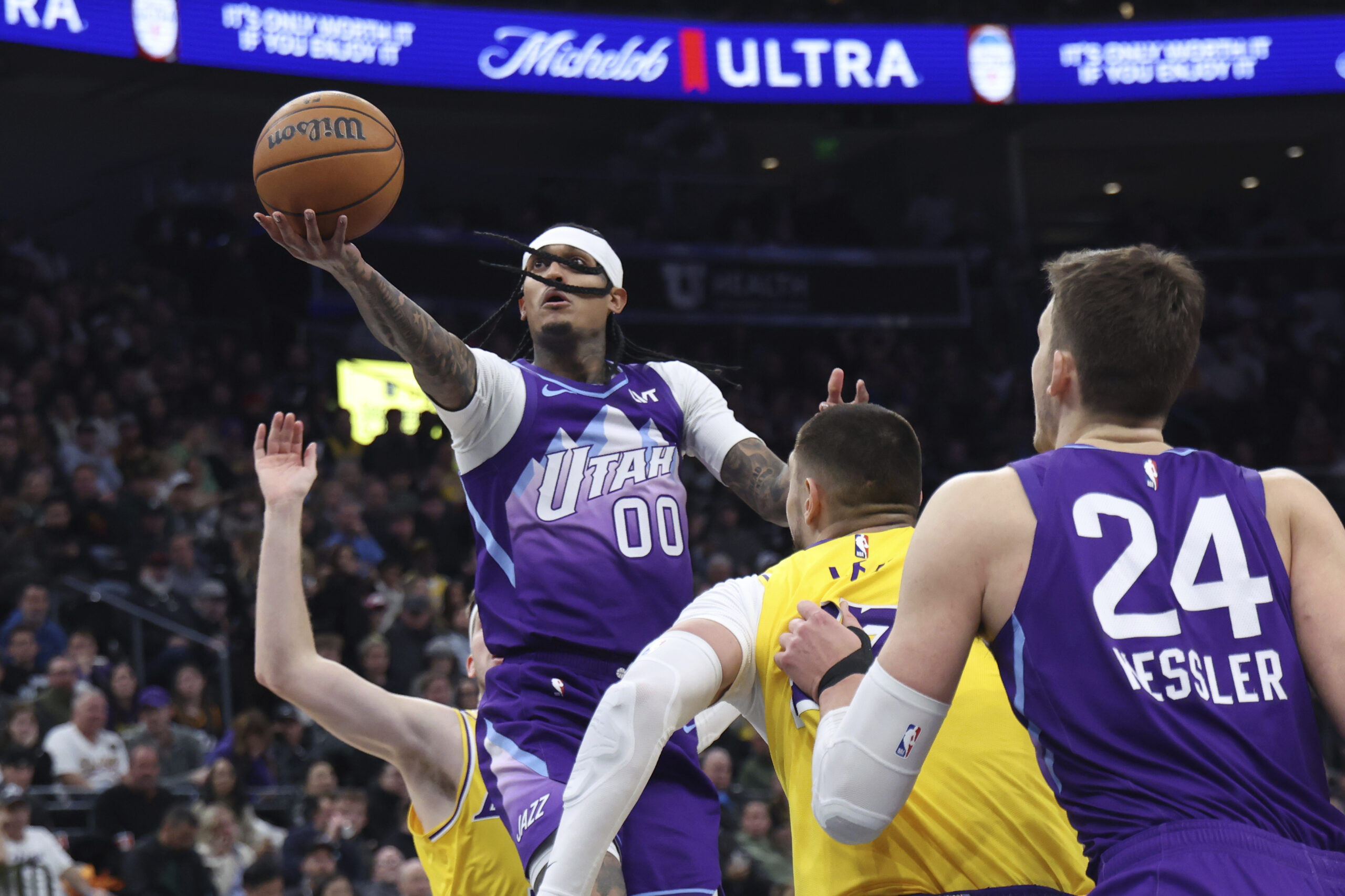 Utah Jazz guard Jordan Clarkson (00) lays the ball up...