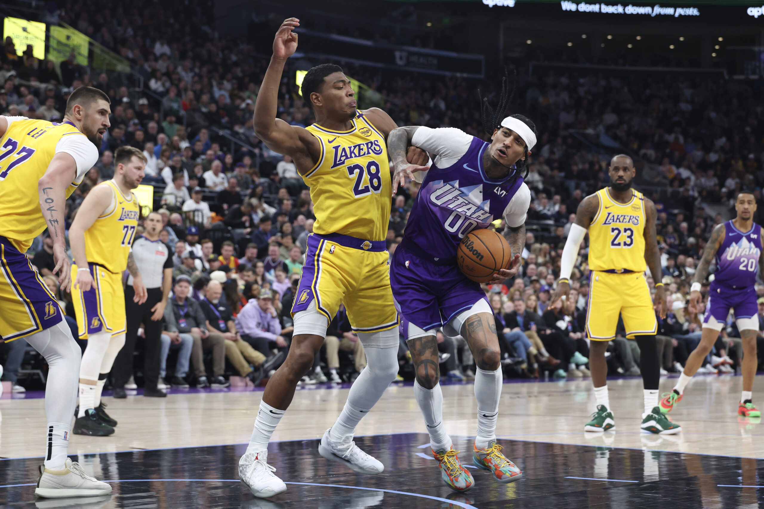 Utah Jazz guard Jordan Clarkson (00) drives against Lakers forward...