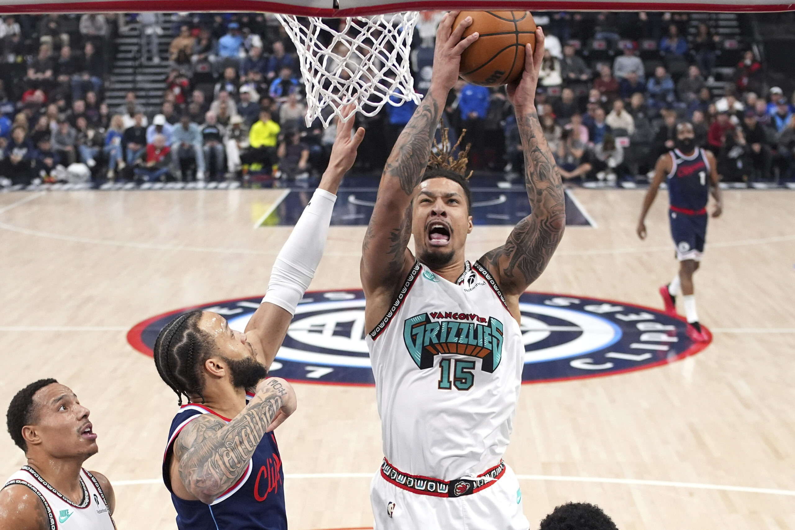 Memphis Grizzlies forward Brandon Clarke, right, shoots as Clippers guard...