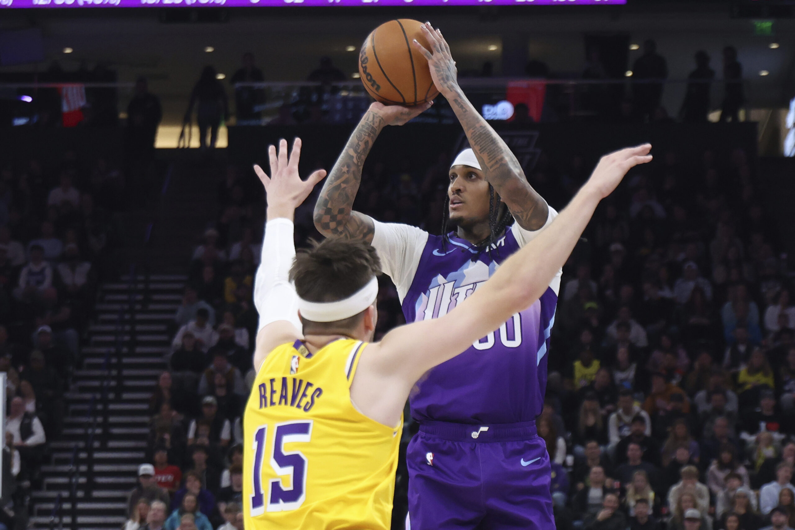 Utah Jazz guard Jordan Clarkson (00) shoots over Lakers guard...