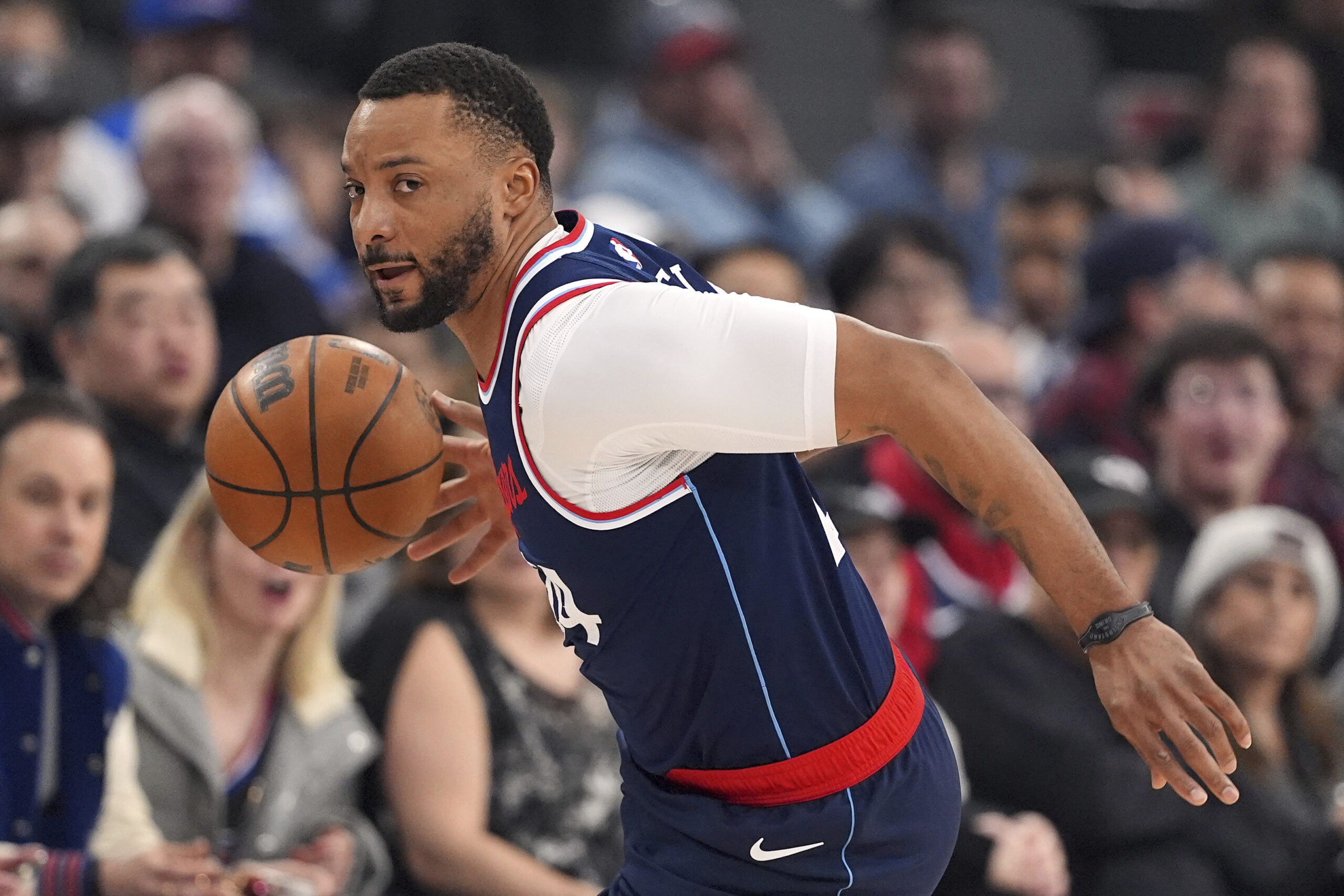 Clippers guard Norman Powell dribbles during the first half of...