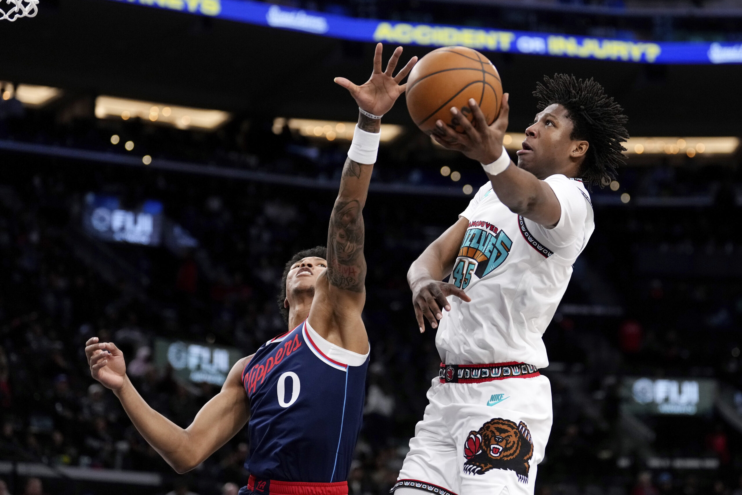 Memphis Grizzlies forward GG Jackson, right, shoots as Clippers forward...