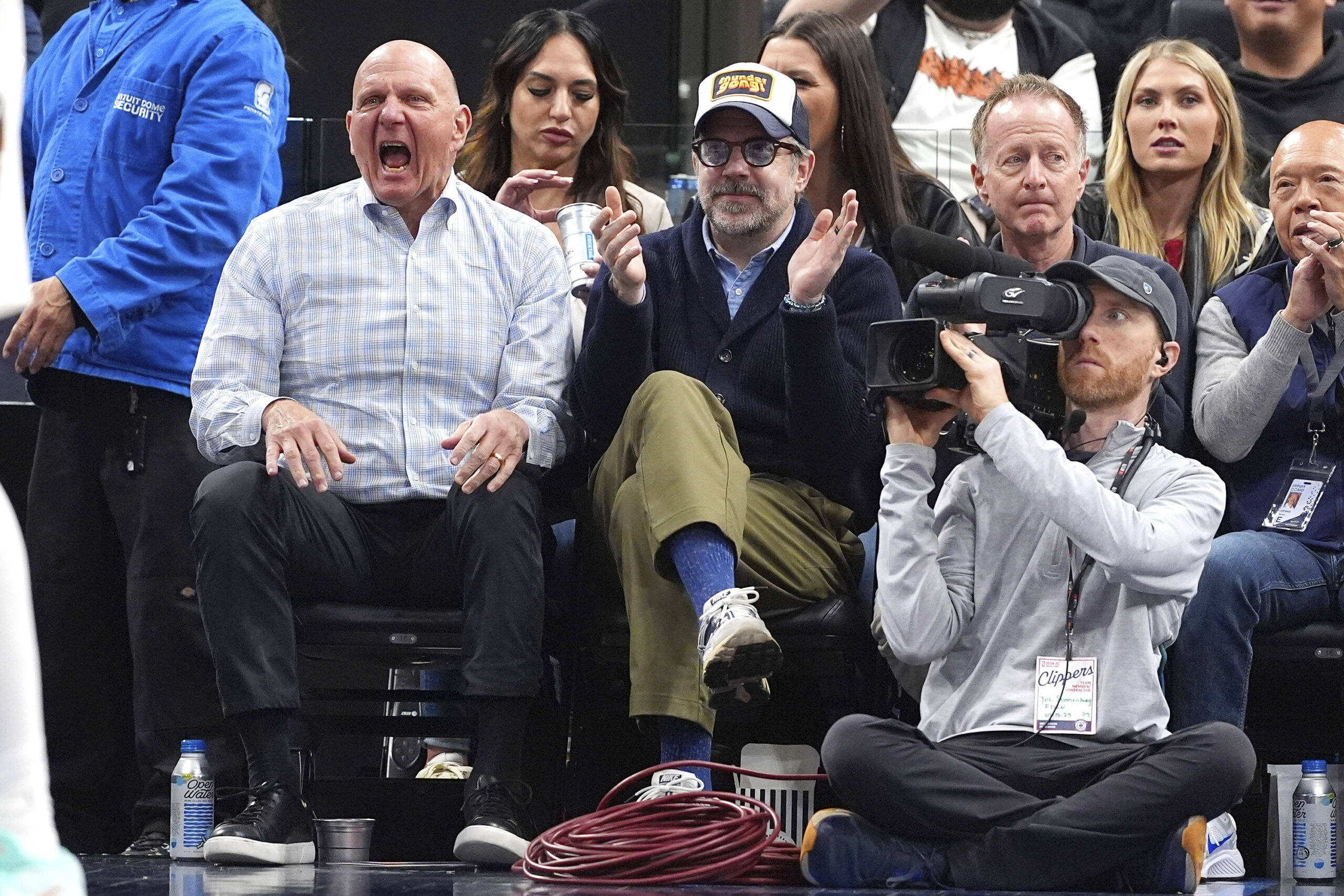 Clippers owner Steve Ballmer, left, and actor Jason Sudeikis celebrate...