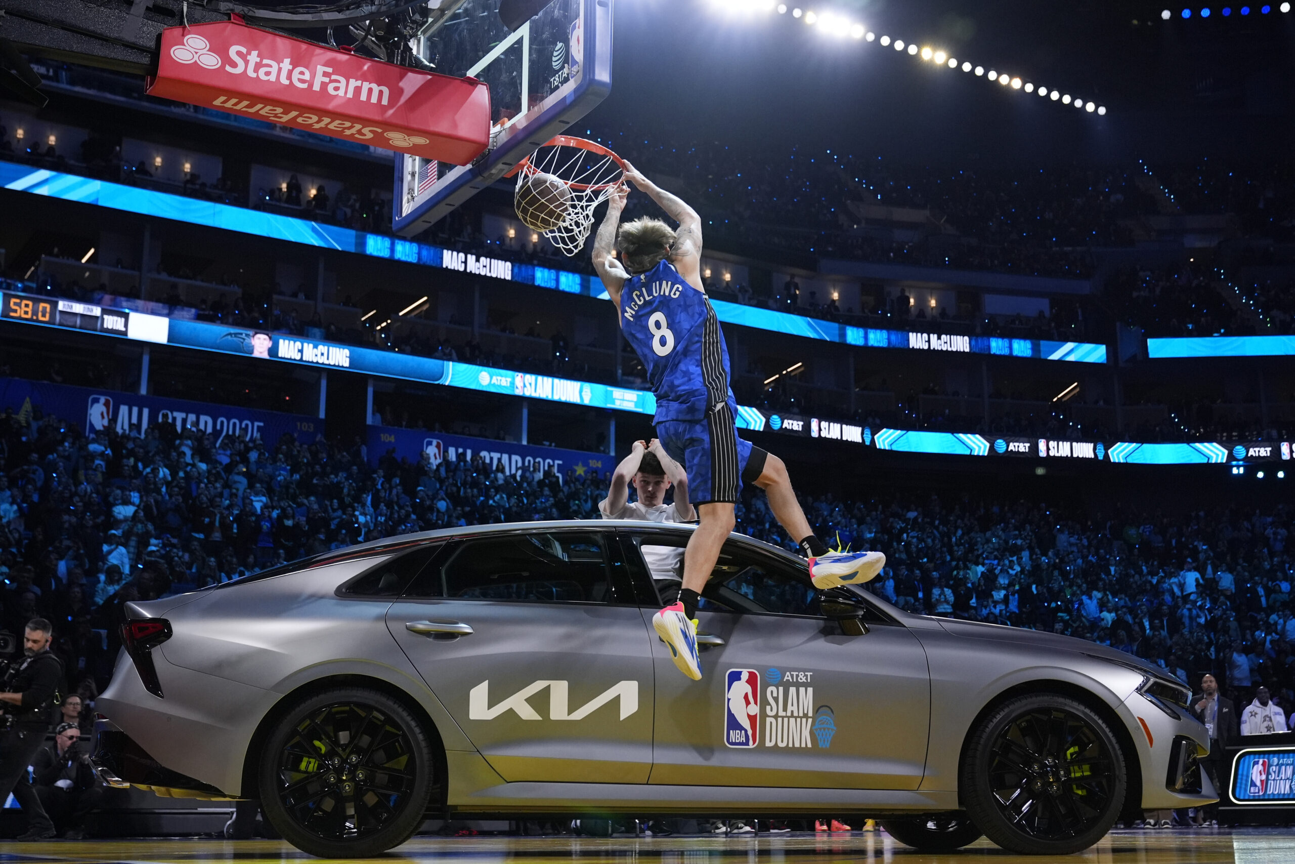 Osceola Magic guard Mac McClung dunks over a car during...