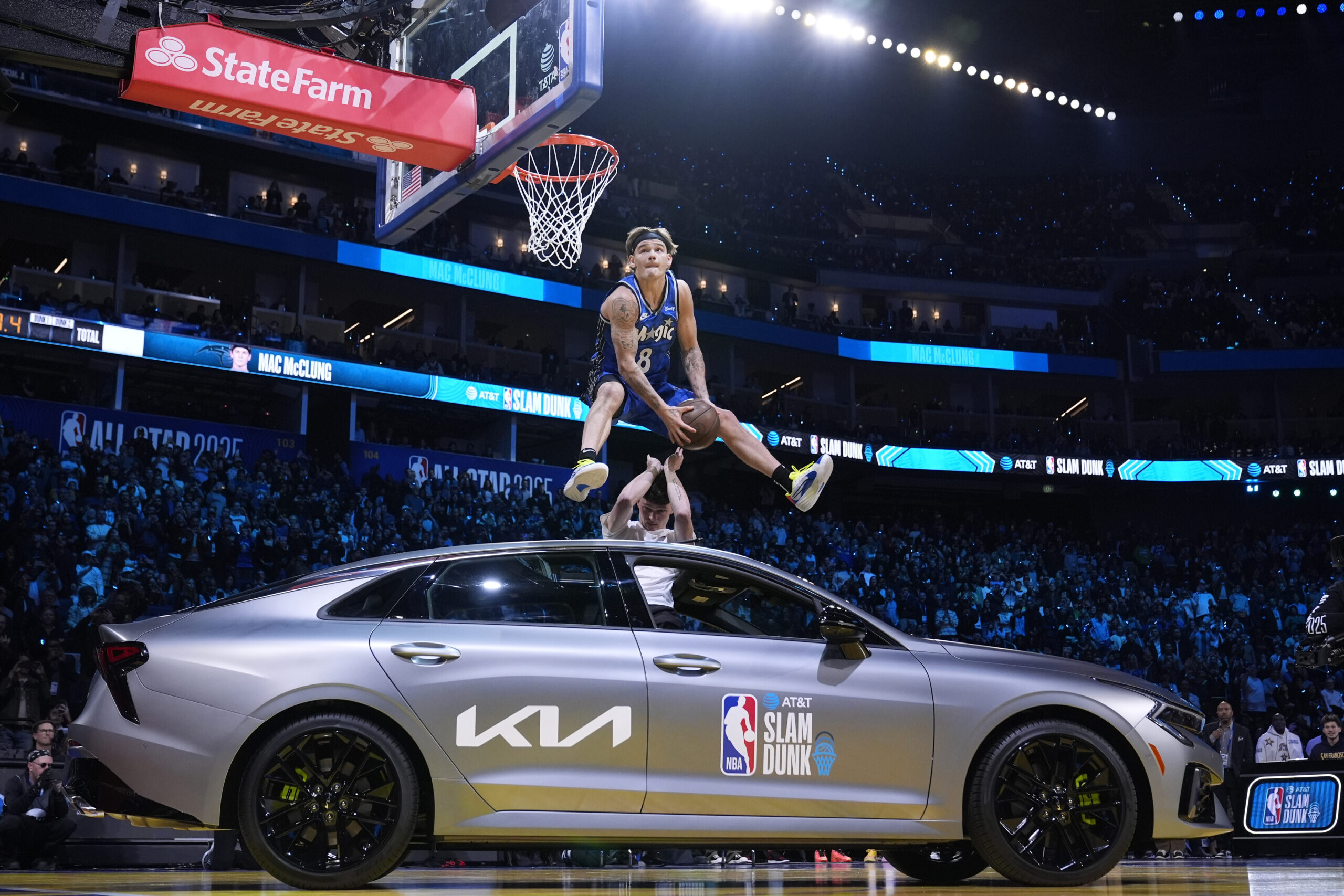 Osceola Magic guard Mac McClung dunks over a car during...