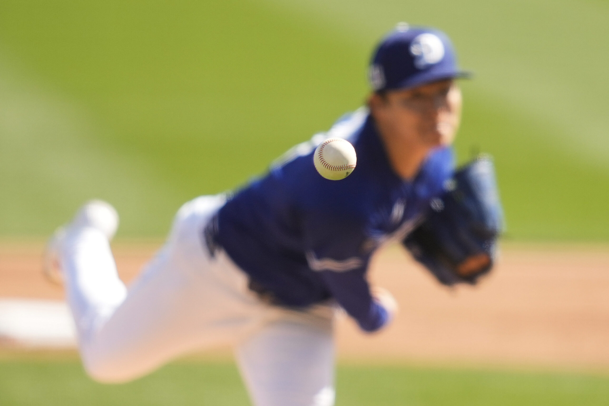 Dodgers starting pitcher Yoshinobu Yamamoto throws during the second inning...