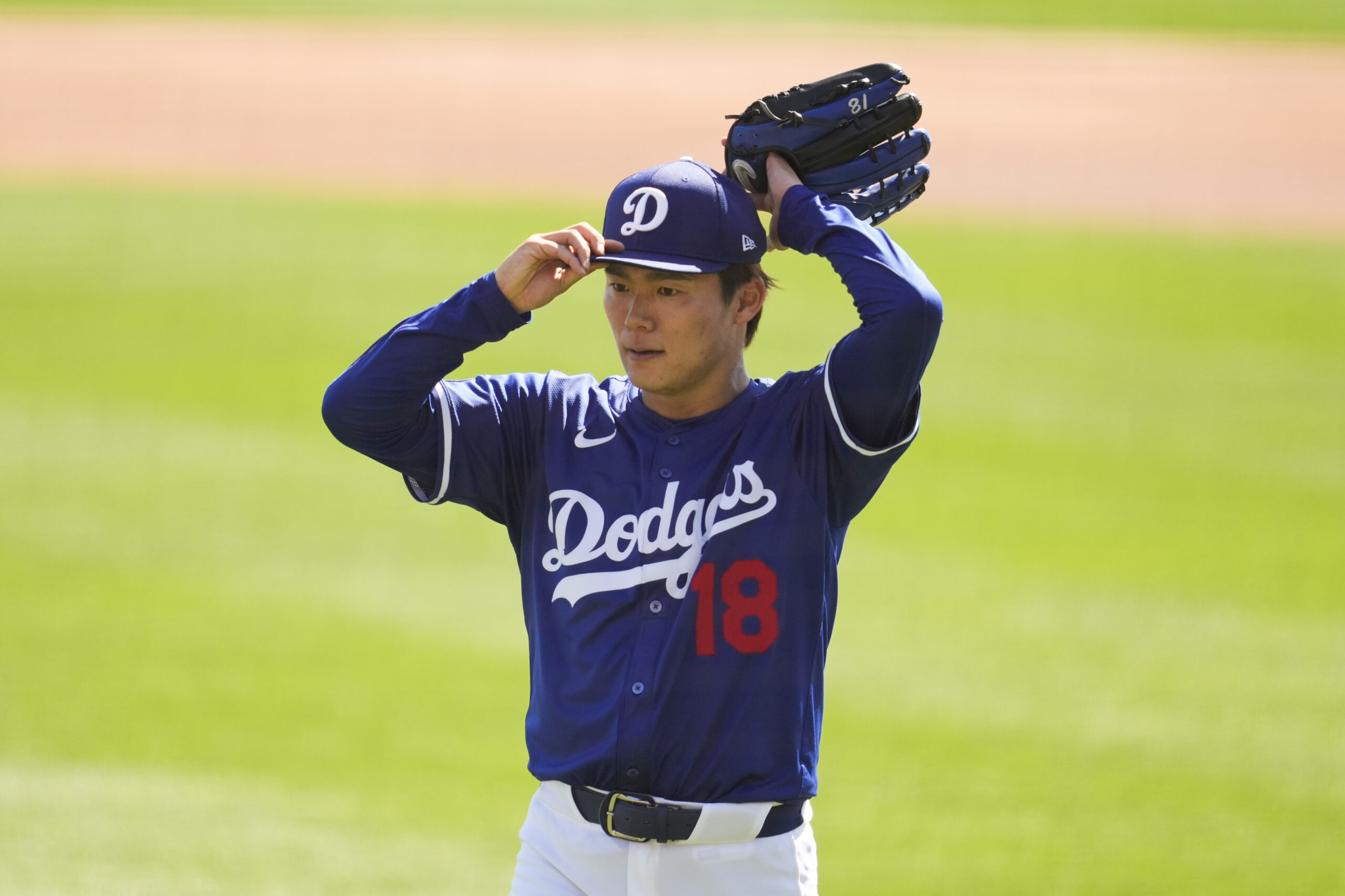 Dodgers starting pitcher Yoshinobu Yamamoto leaves the mound during the...