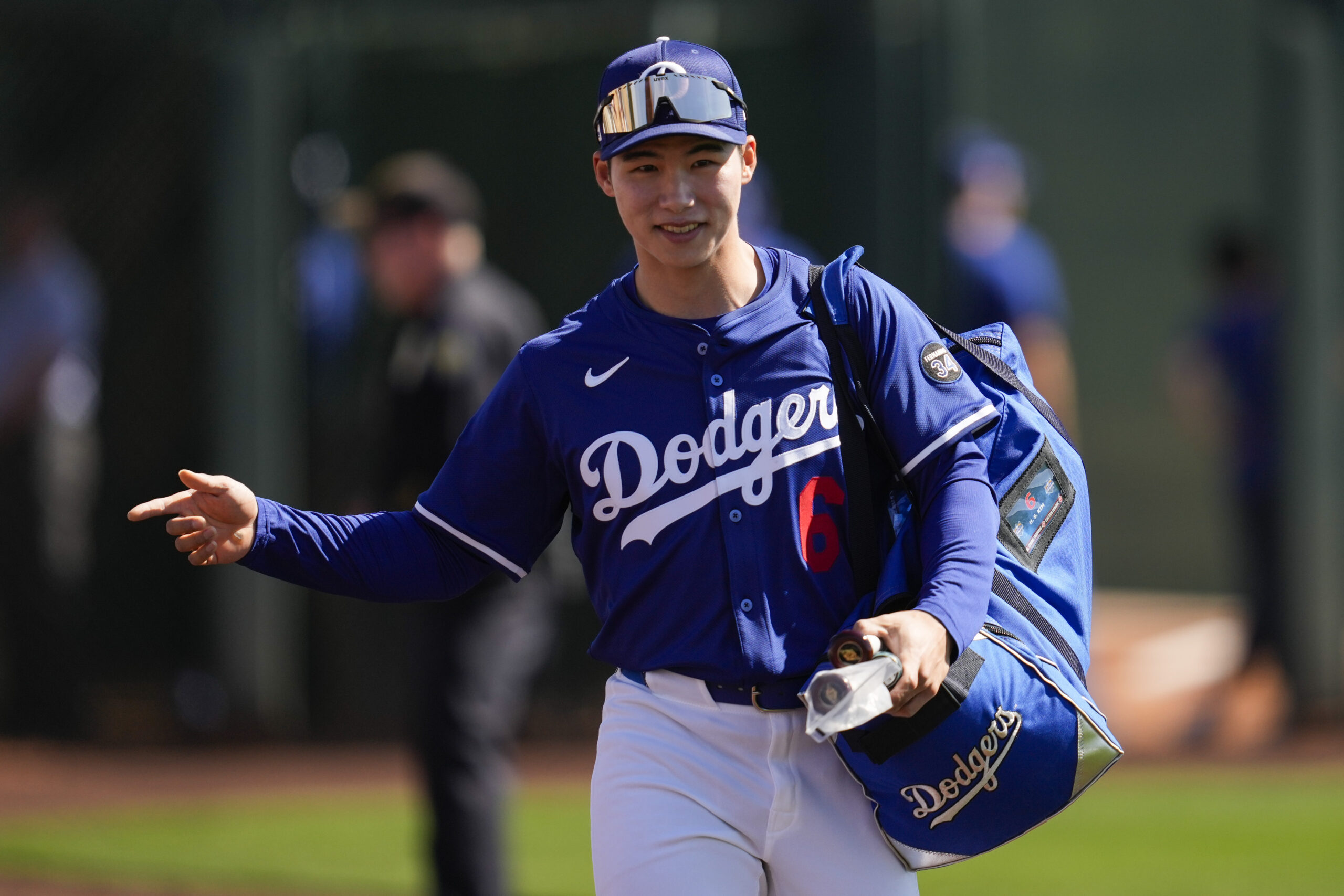 Dodgers second baseman Hyeseong Kim greets fans before a spring...