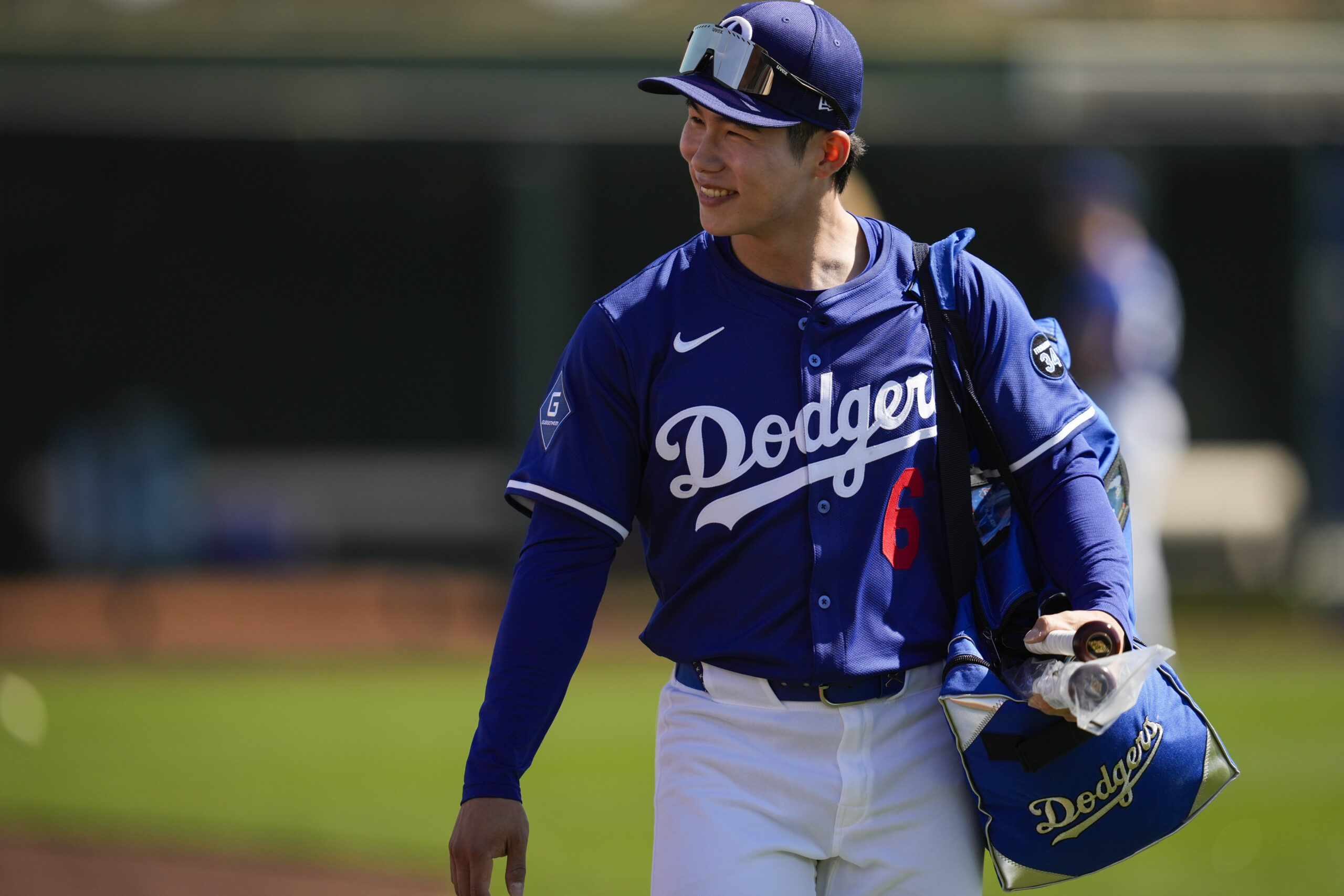 Dodgers second baseman Hyeseong Kim greets fans before a spring...