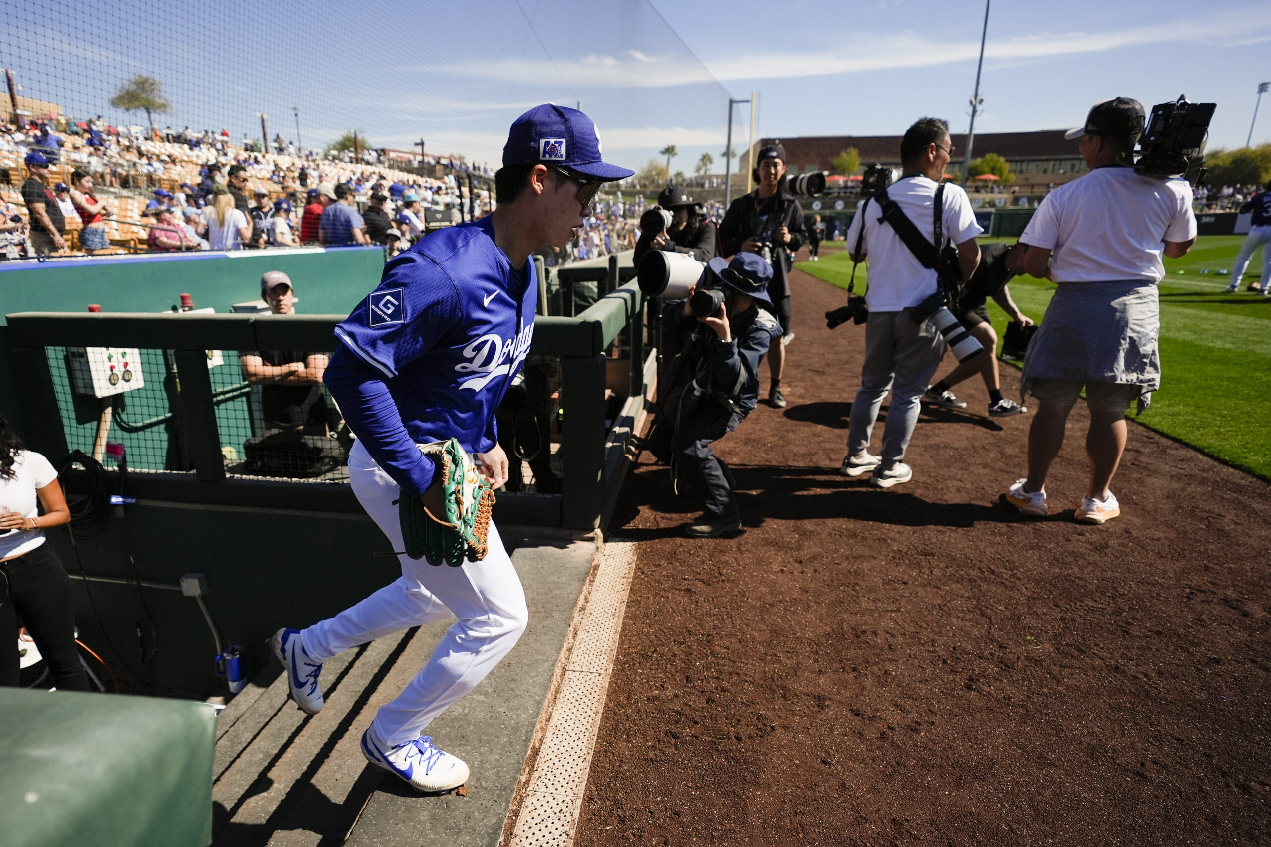 Dodgers second baseman Hyeseong Kim enters the field before a...