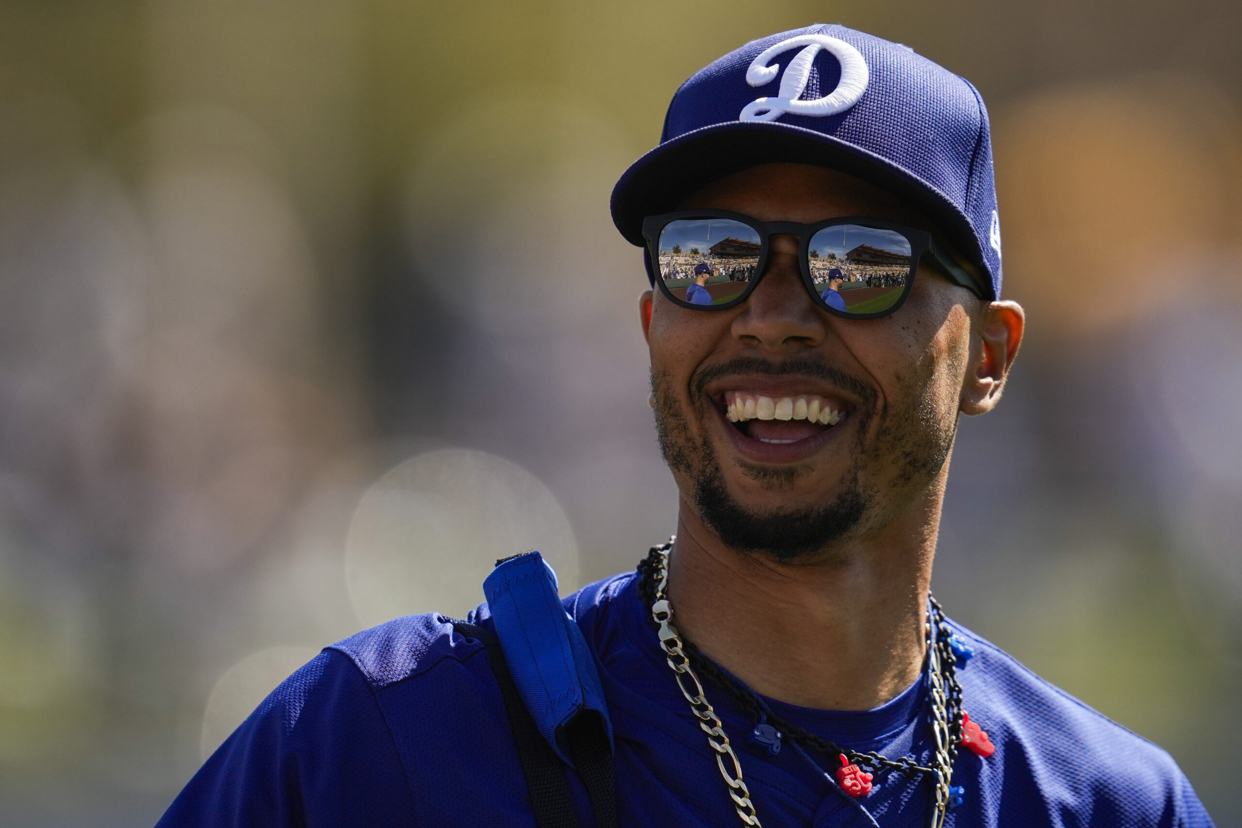 Dodgers shortstop Mookie Betts walks on to the field before...