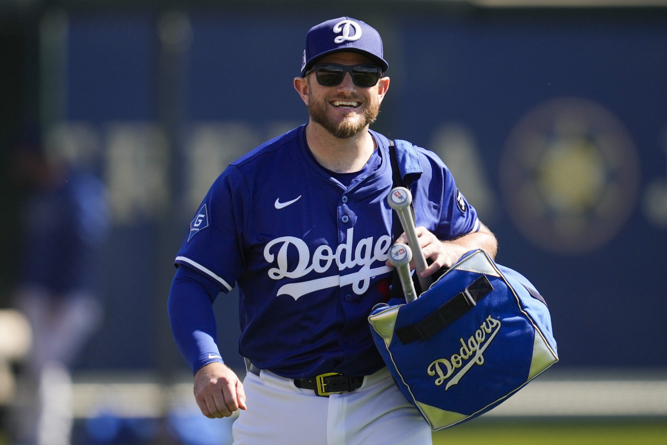 Dodgers third baseman Max Muncy walks on to the field...