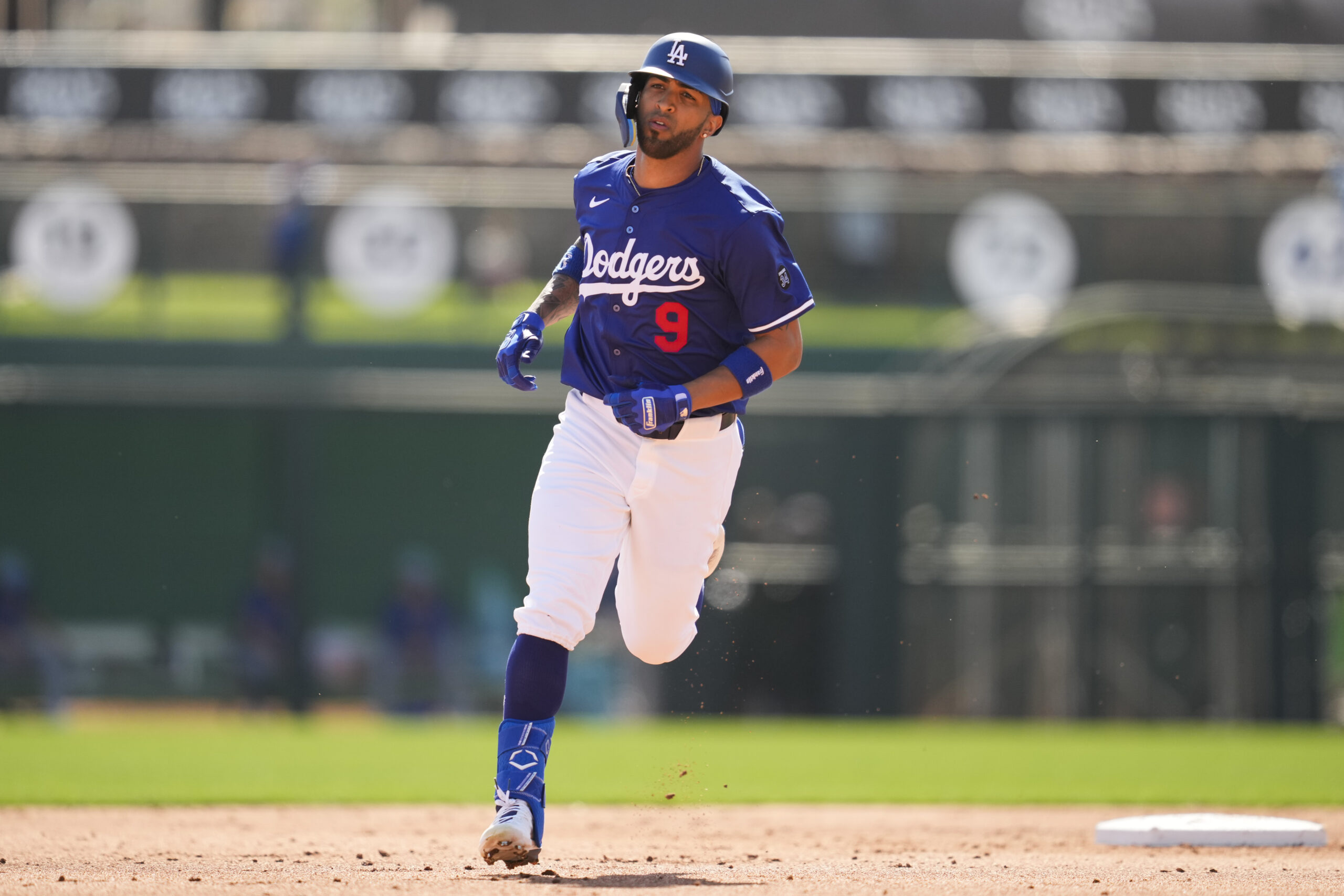 The Dodgers’ Eddie Rosario runs the bases after hitting a...