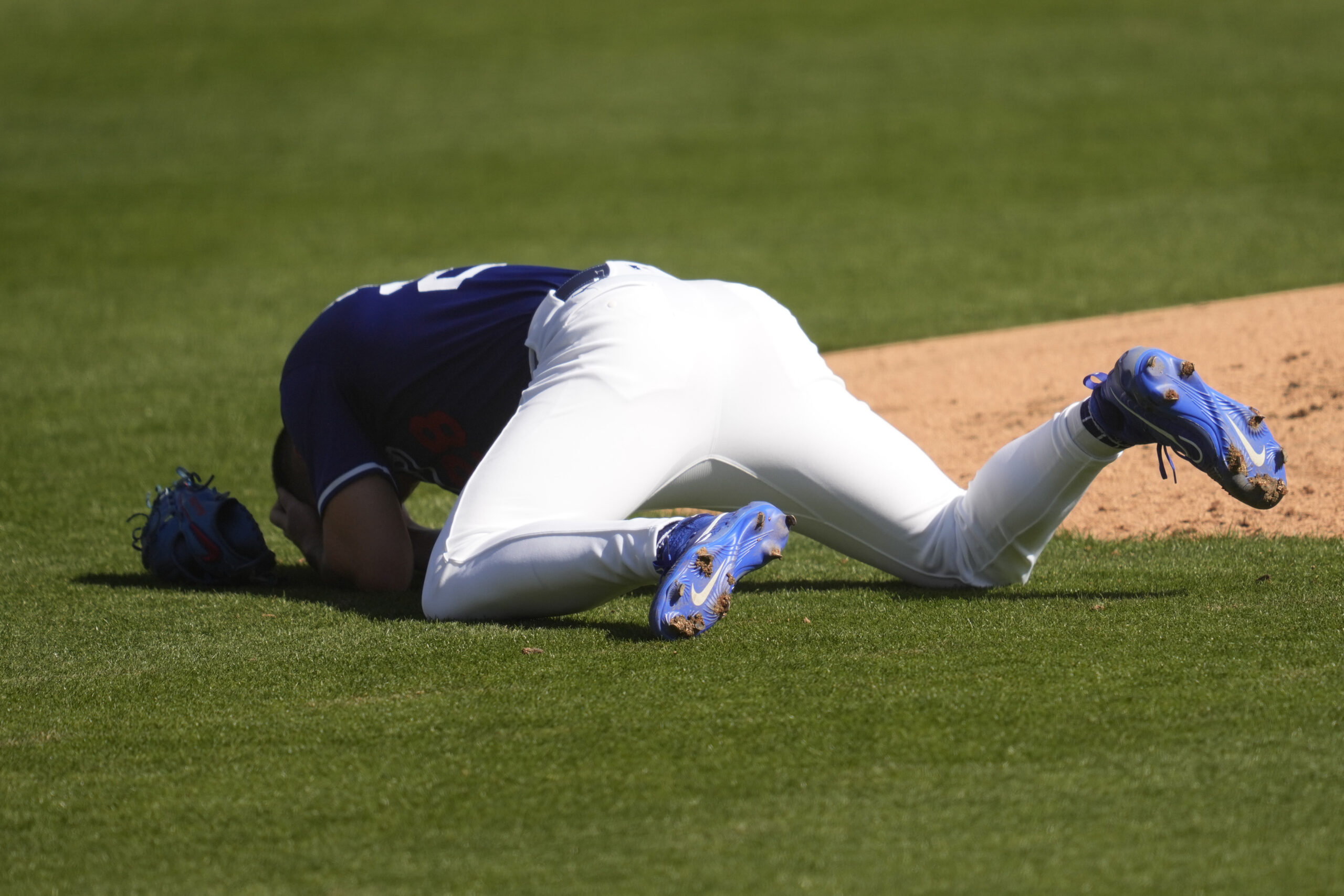 Dodgers pitcher Bobby Miller reacts after being hit in the...