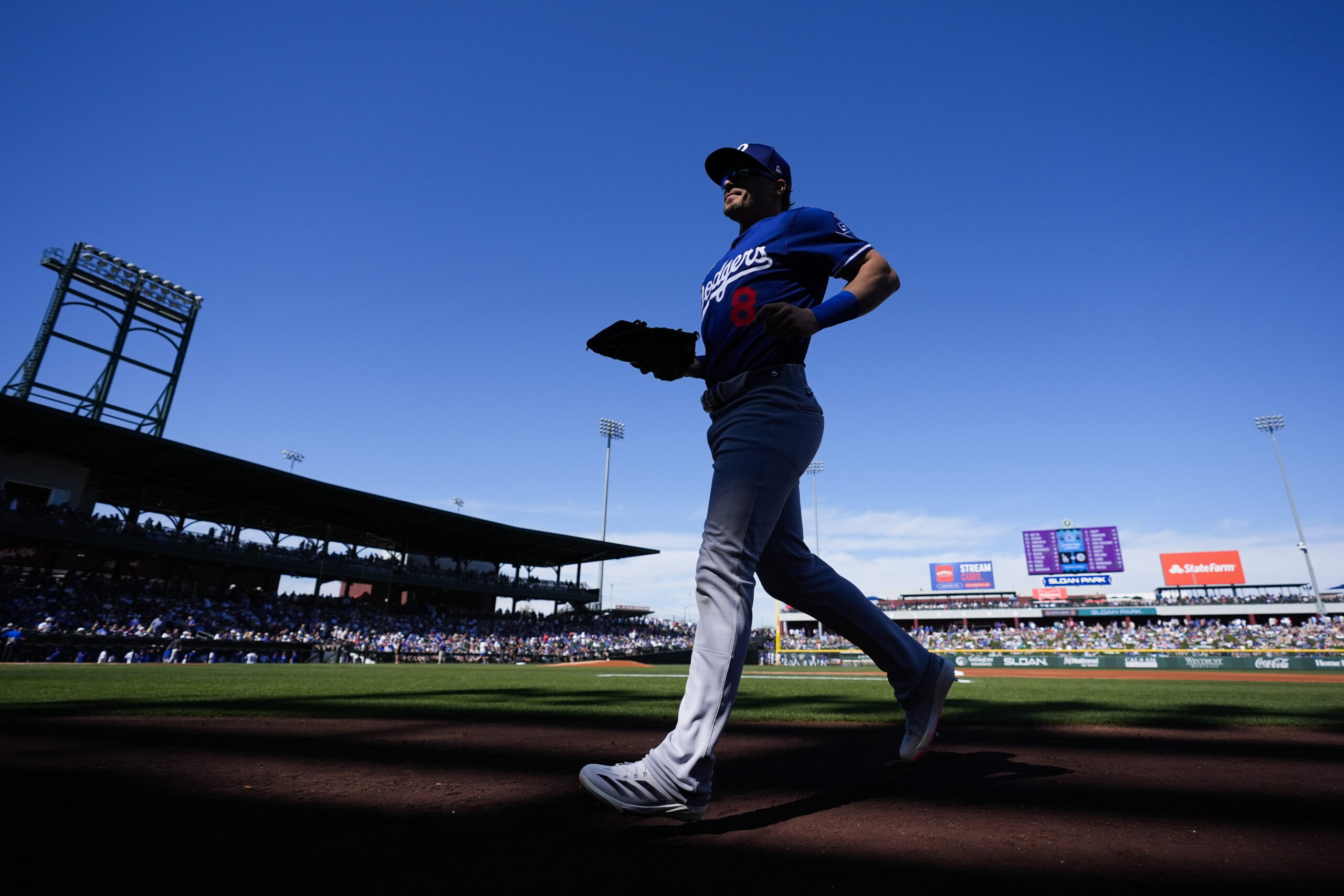 Dodgers first baseman Kiké Hernández rusn to the dugout before...