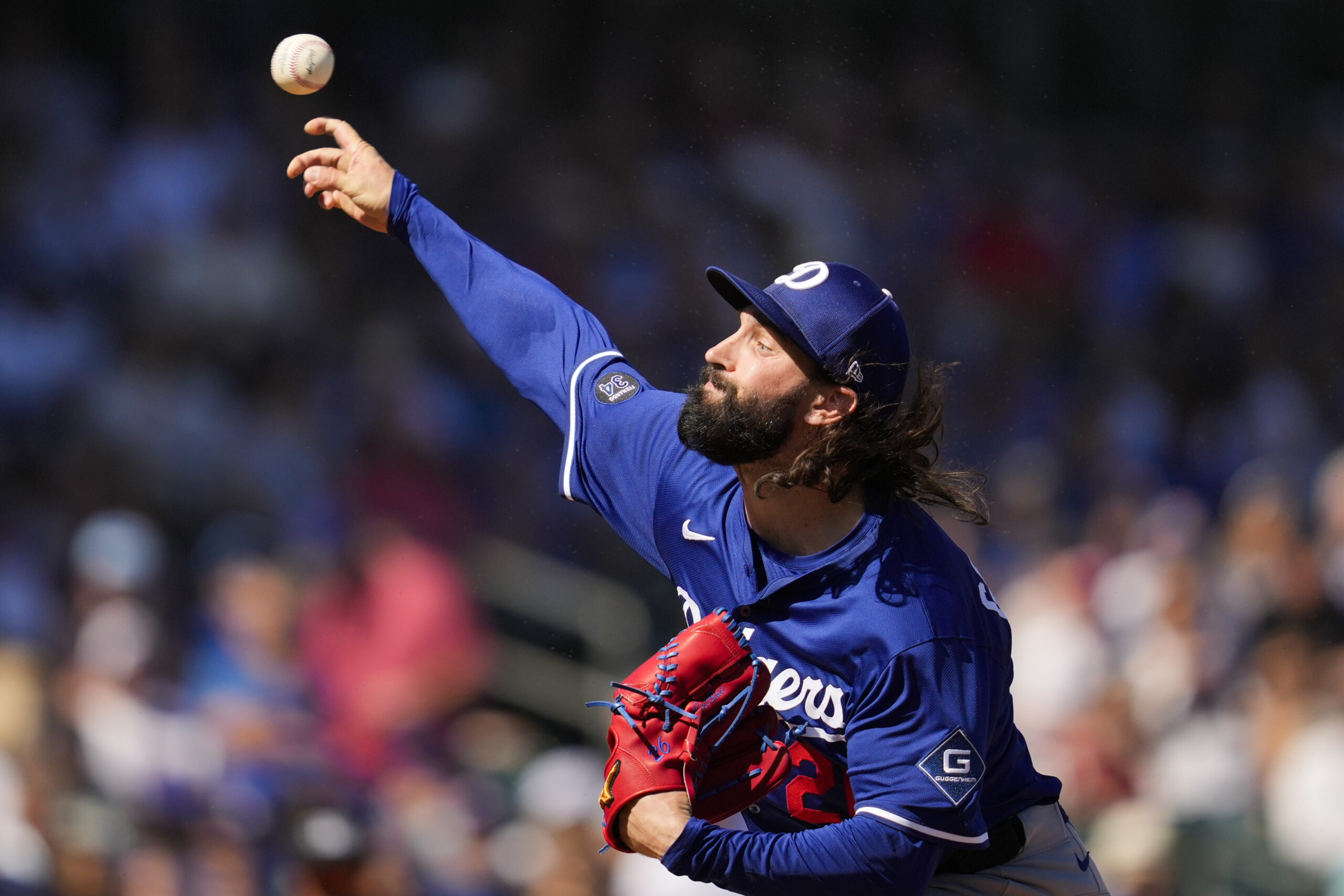 Dodgers starting pitcher Tony Gonsolin throws to the plate during...