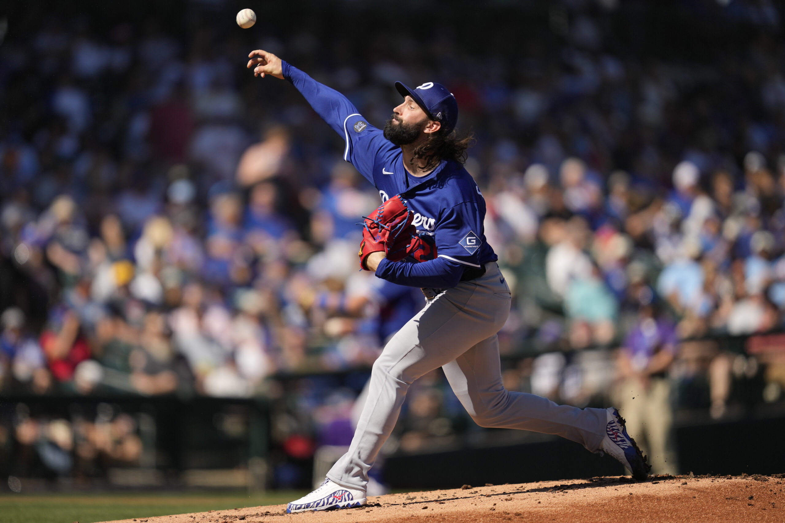 Dodgers starting pitcher Tony Gonsolin throws during the first inning...