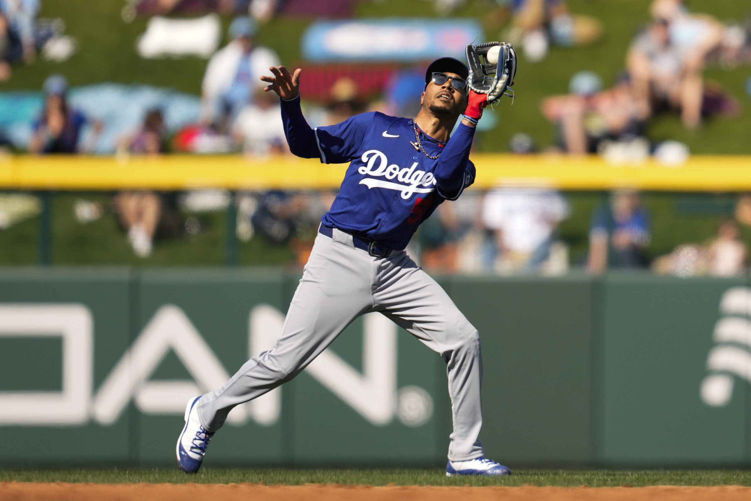 Dodgers shortstop Mookie Betts catches a fly ball hit by...