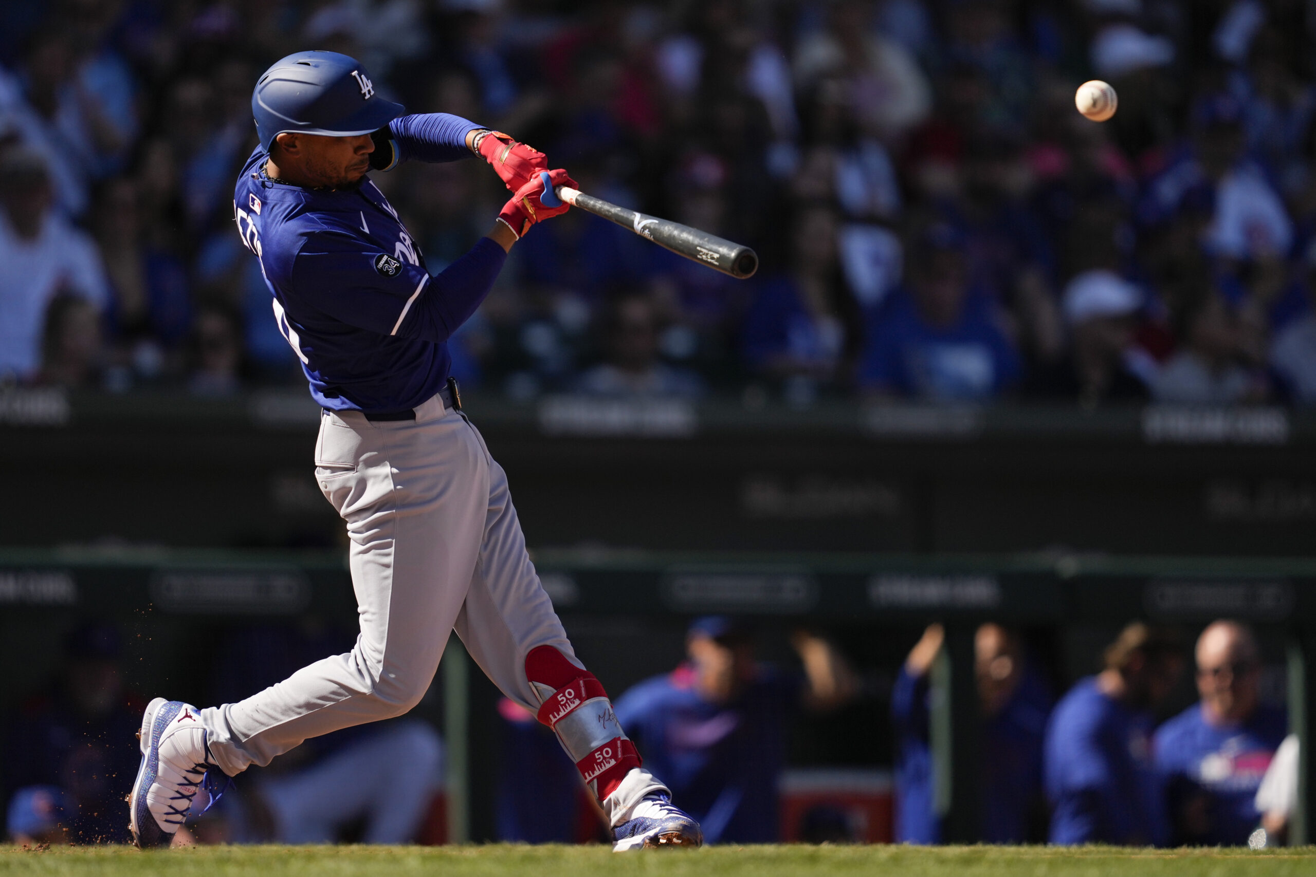 The Dodgers’ Mookie Betts singles during the third inning of...