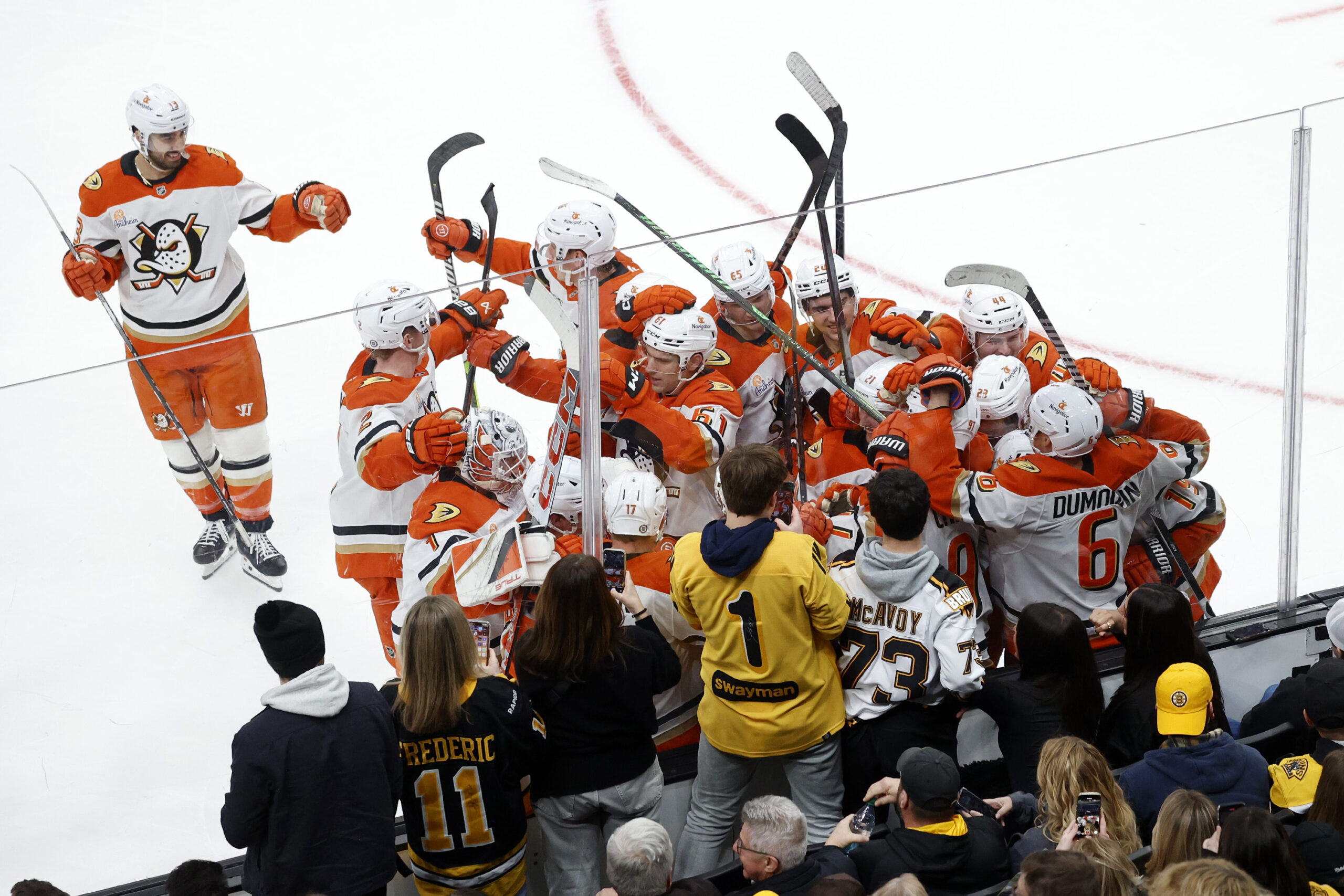 Ducks players celebrate after their win in the first overtime...