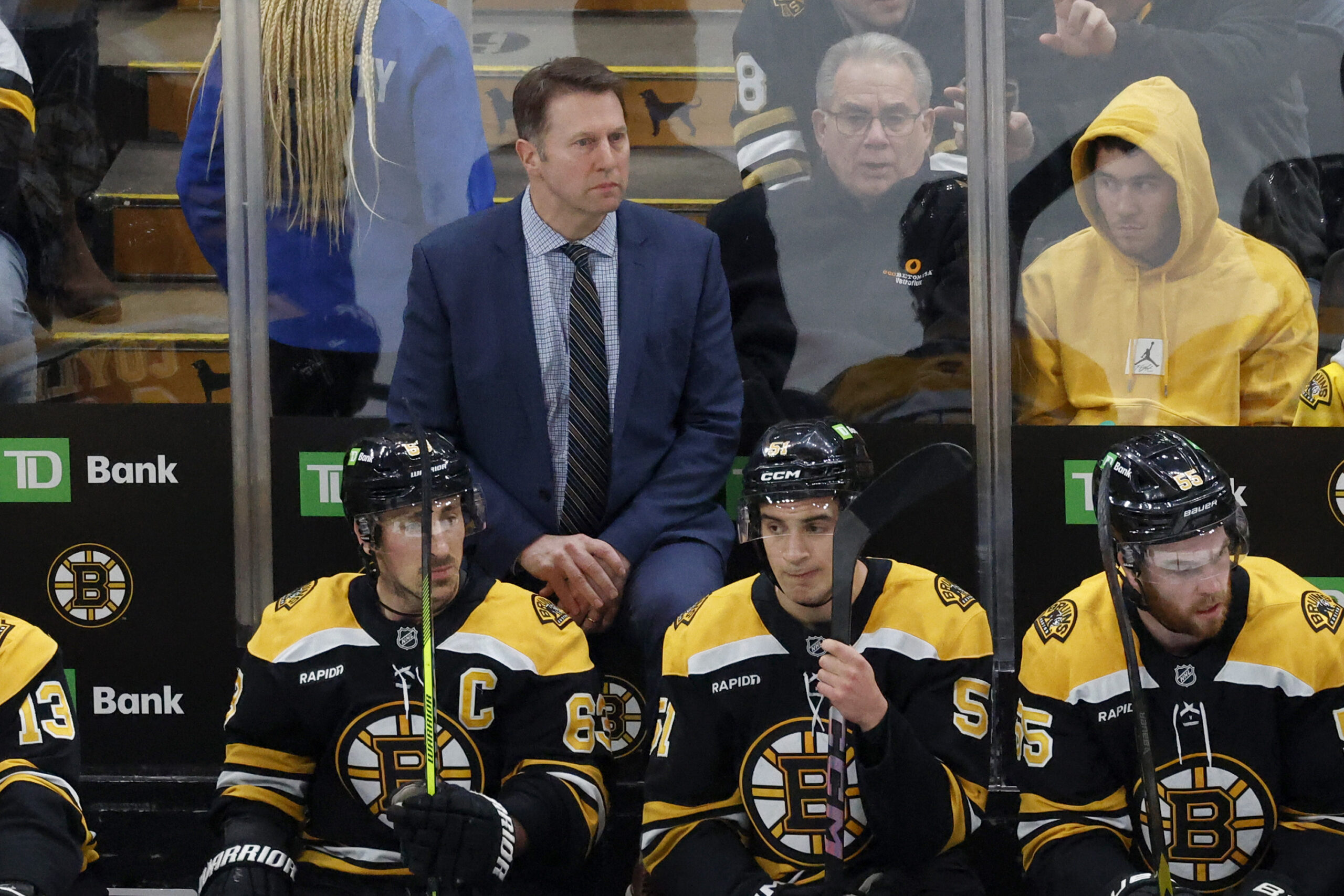 Boston Bruins interim head coach Joe Sacco, center top, looks...