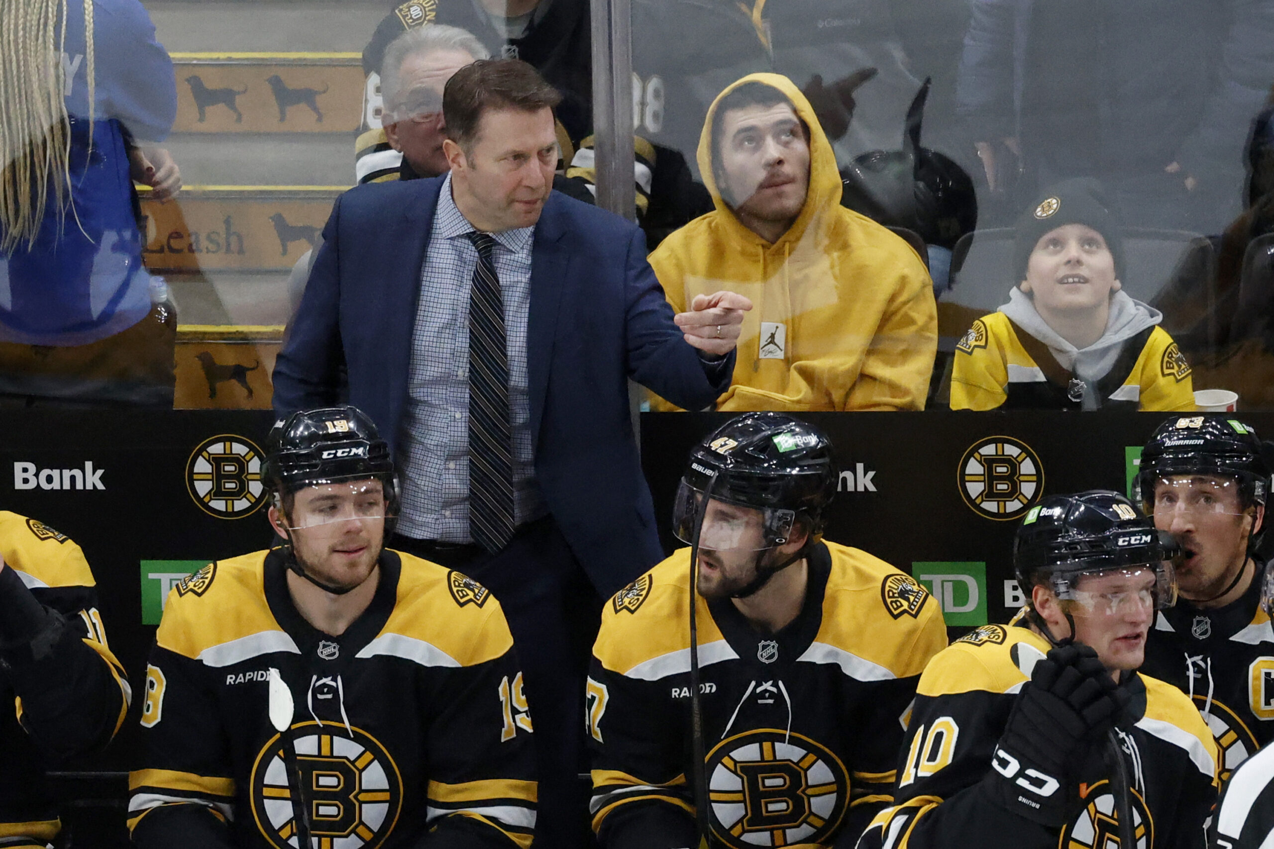 Boston Bruins interim head coach Joe Sacco directs his team...