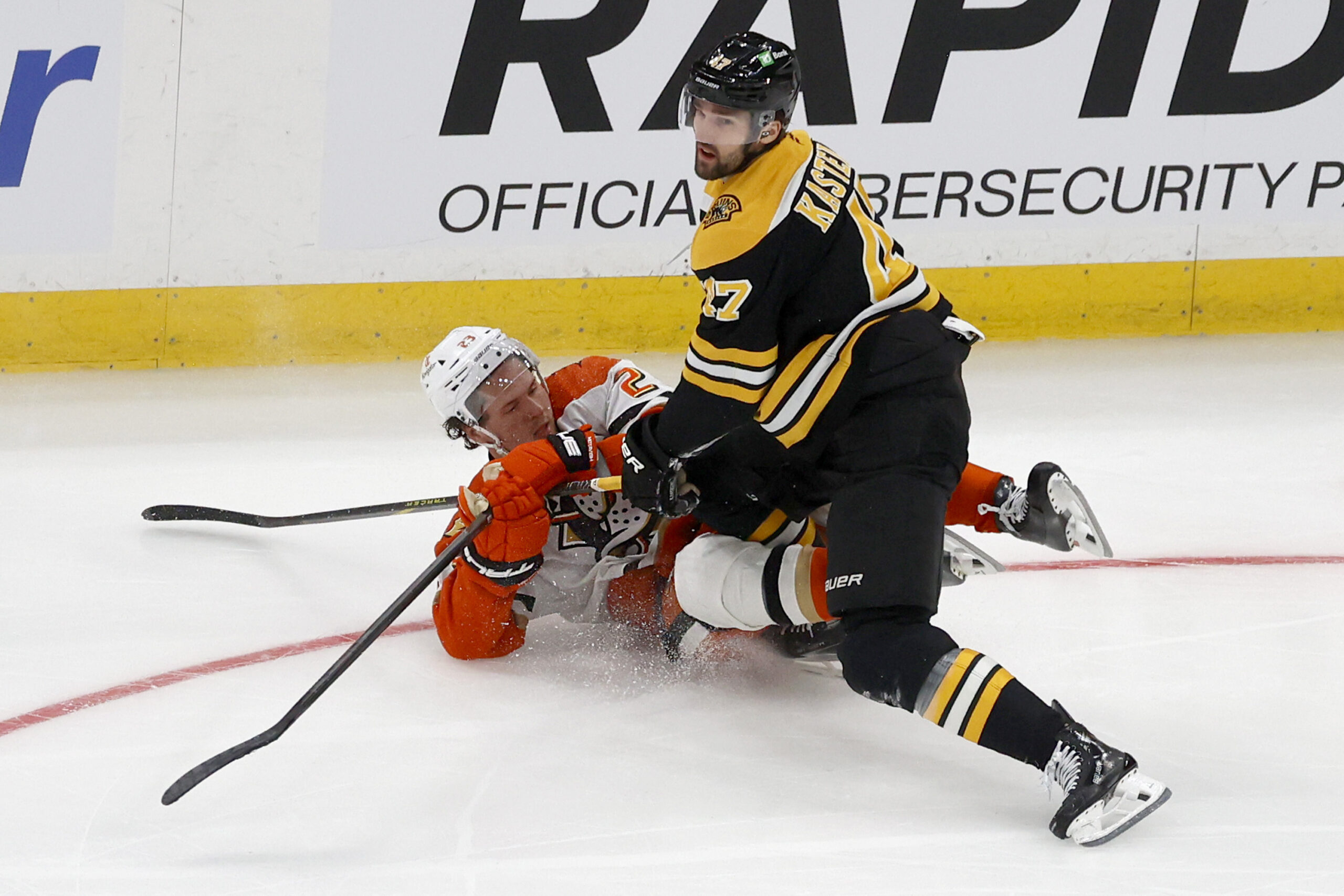 Boston Bruins center Mark Kastelic (47) and Ducks center Mason...