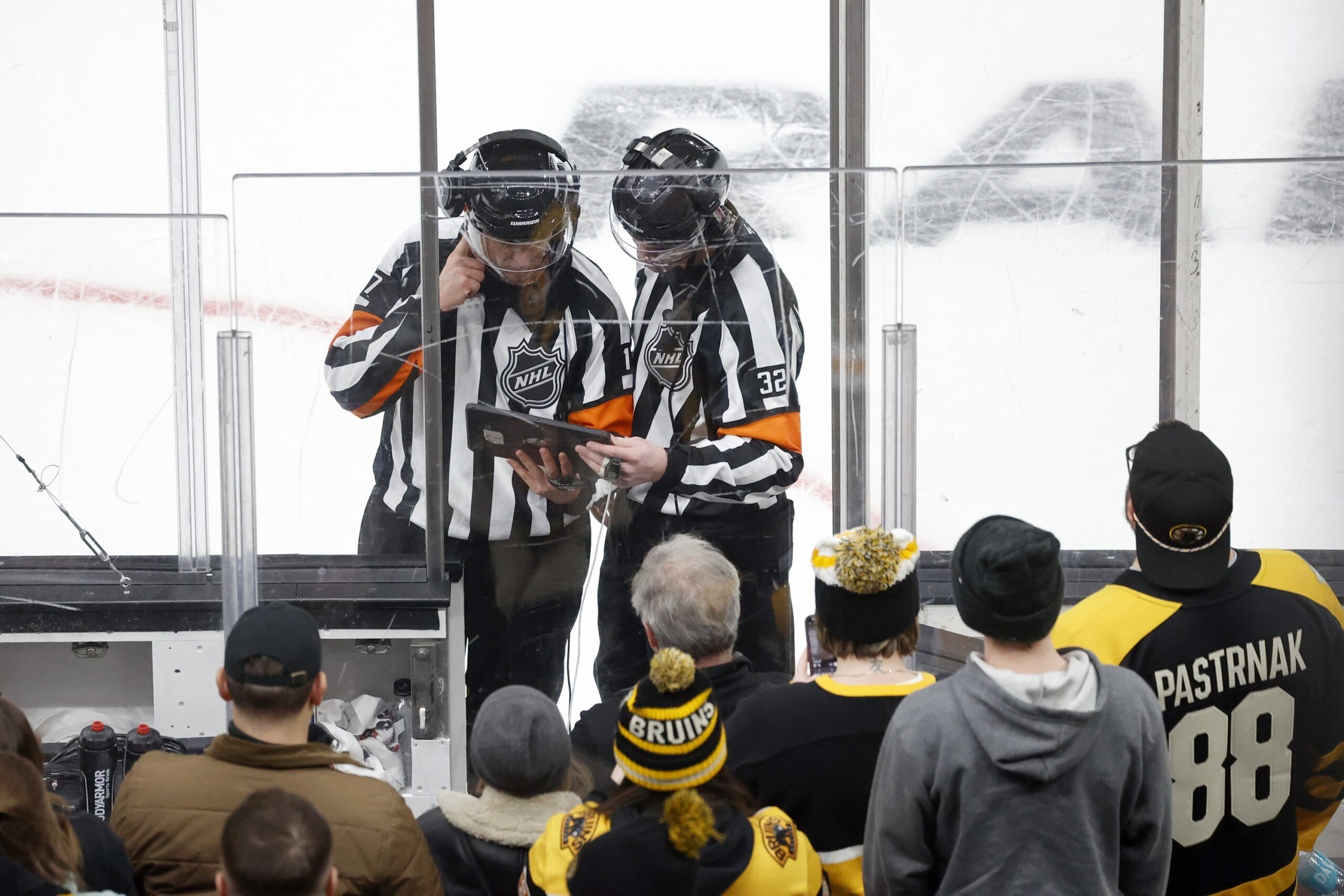 Referees review a scoring play on a coaches challenge by...