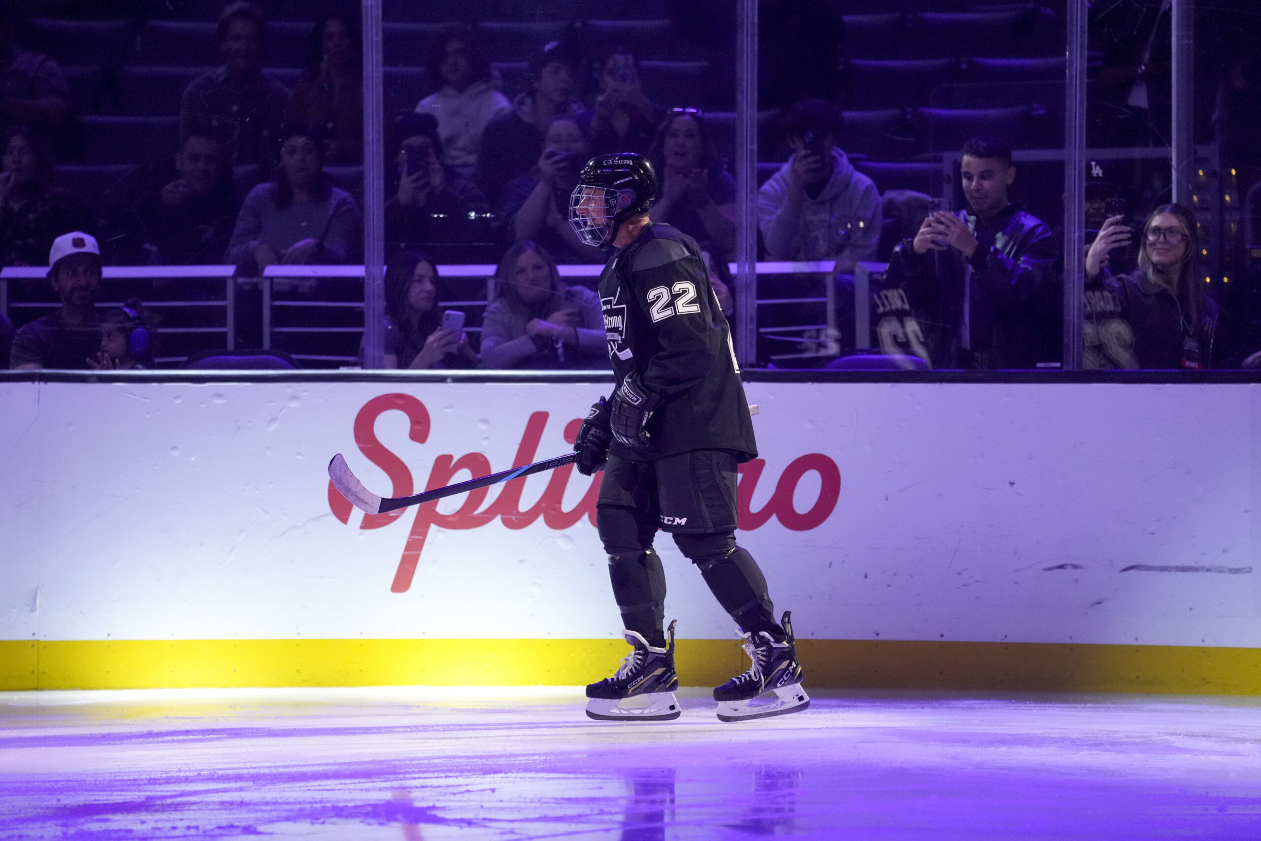 Team Black player actor Steve Carell takes the ice during...