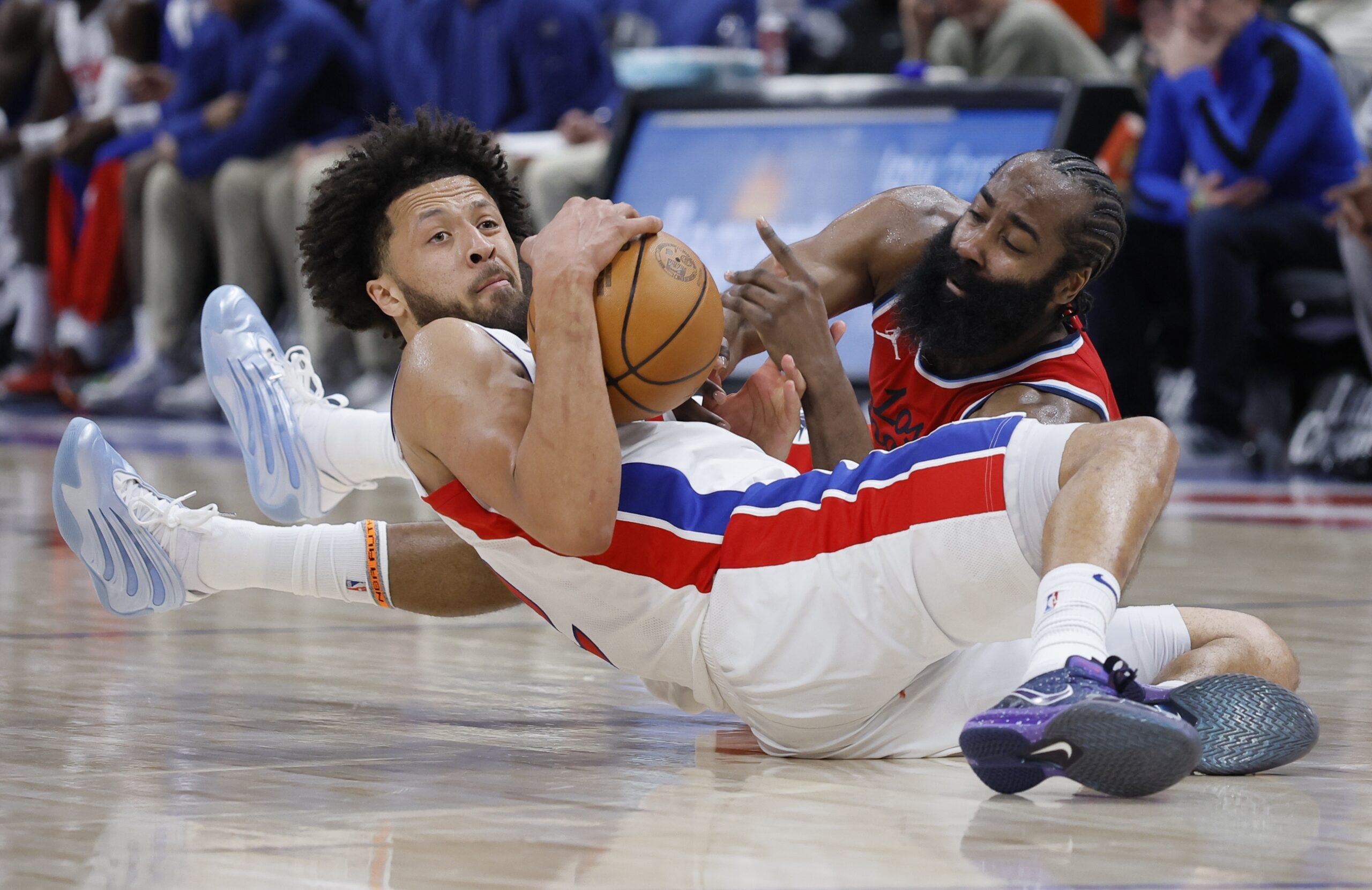 Detroit Pistons guard Cade Cunningham, left, beats Clippers guard James...