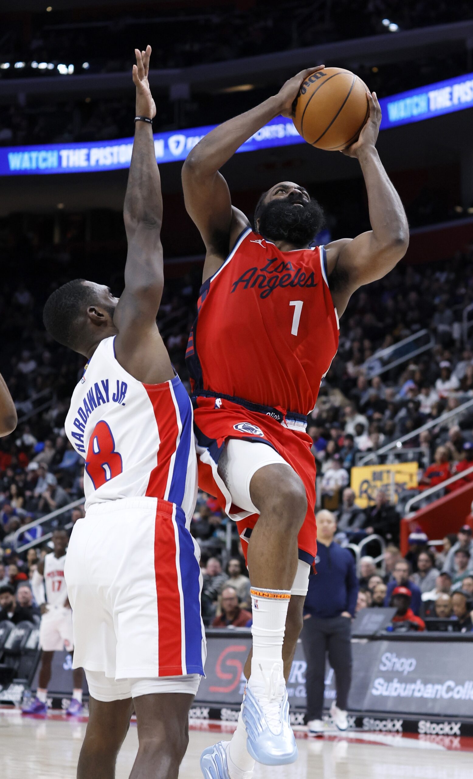 Clippers guard James Harden (1) goes to the basket against...