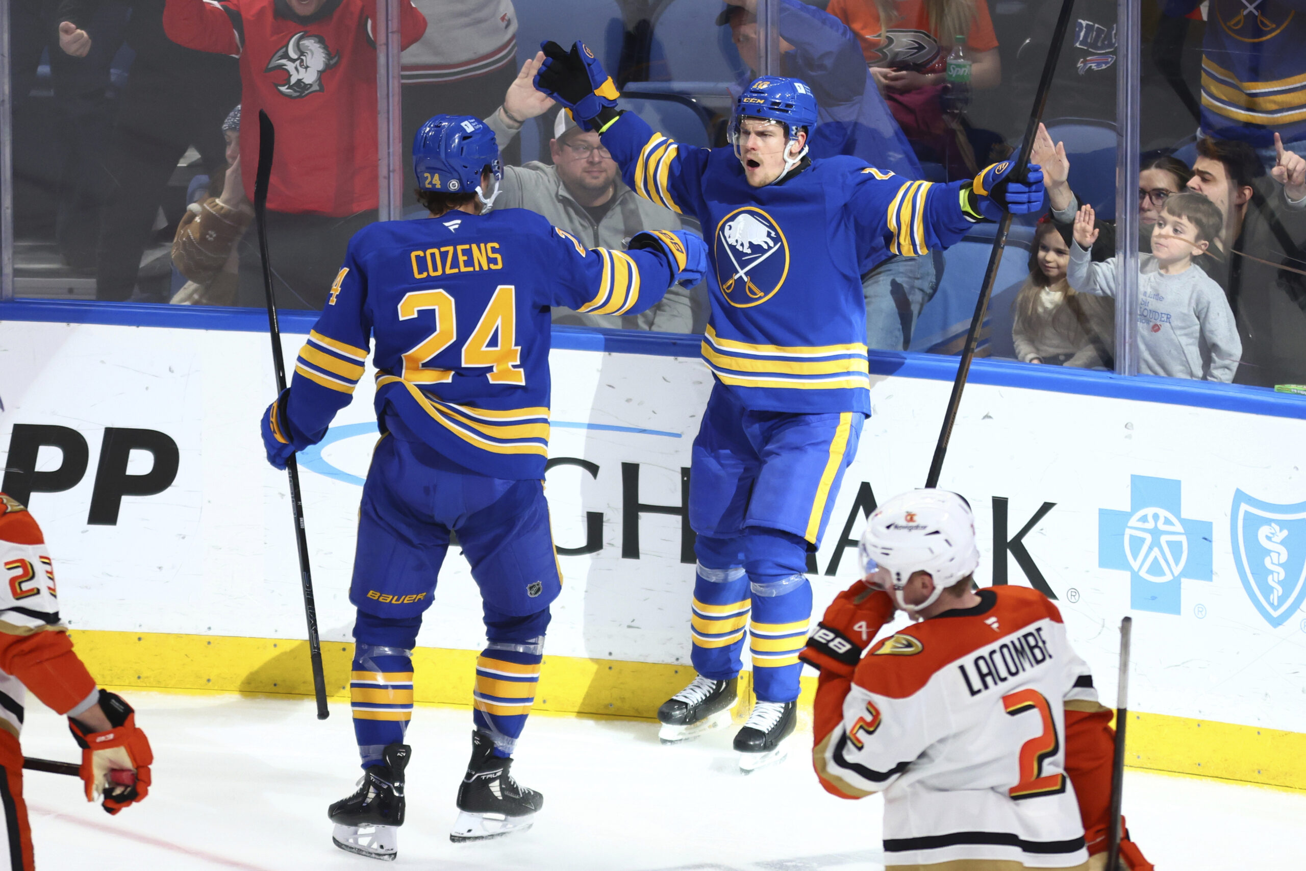 Buffalo Sabres defenseman Henri Jokiharju celebrates his goal with center...