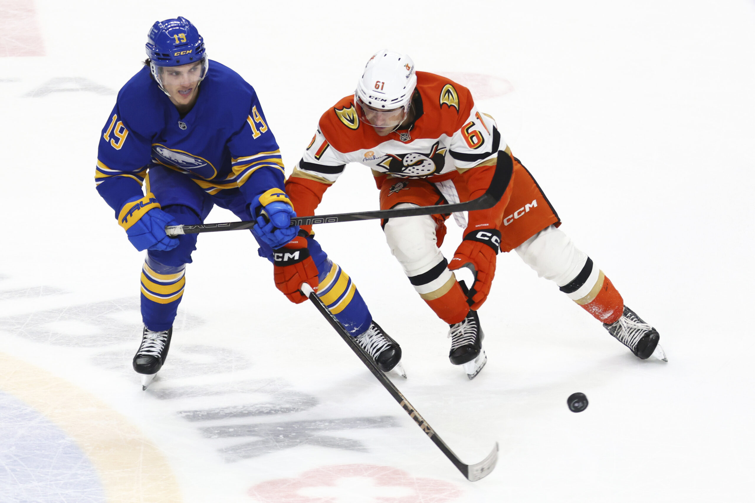 Buffalo Sabres center Peyton Krebs (19) pushes the puck past...