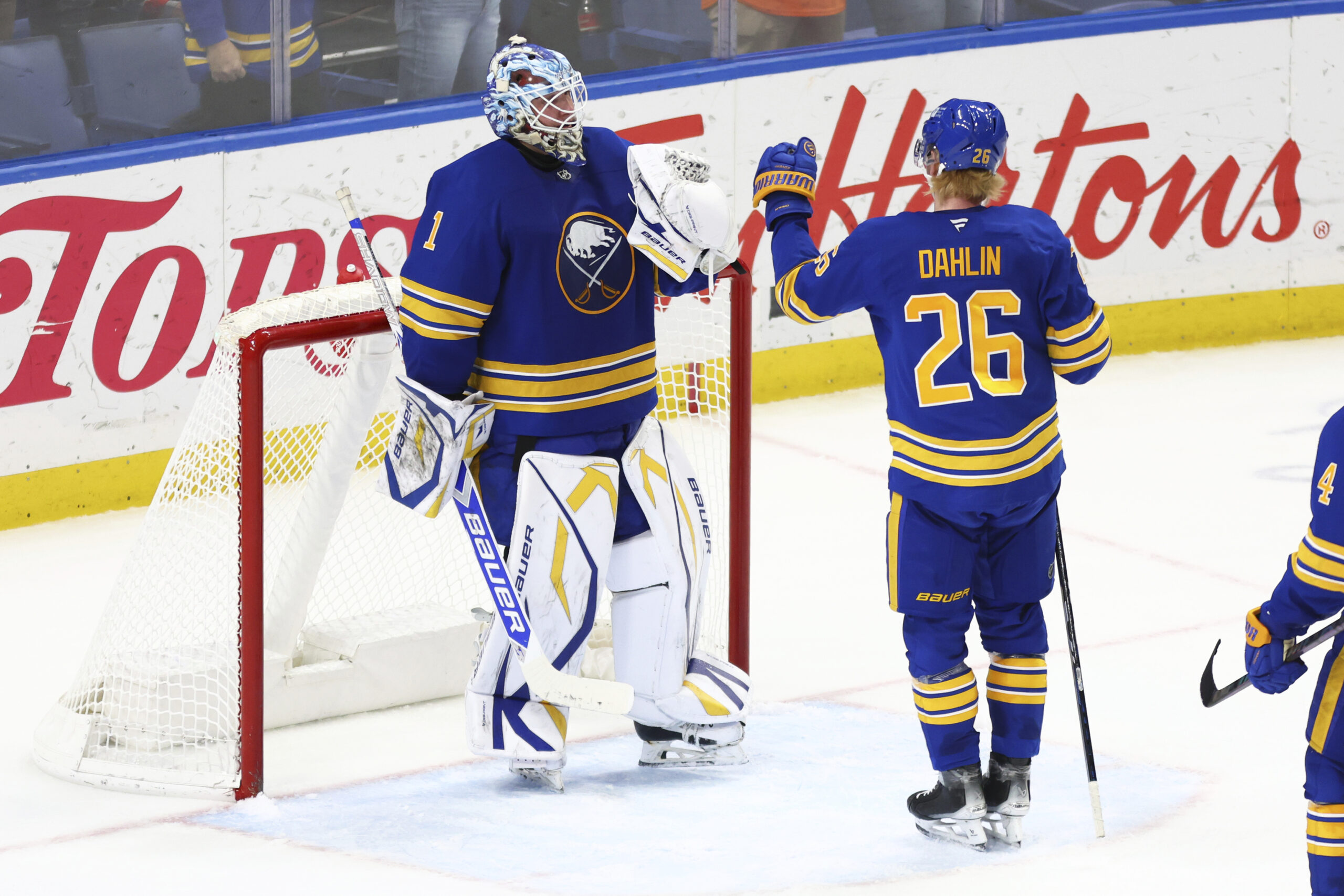 Buffalo Sabres goaltender Ukko-Pekka Luukkonen (1) and defenseman Rasmus Dahlin...