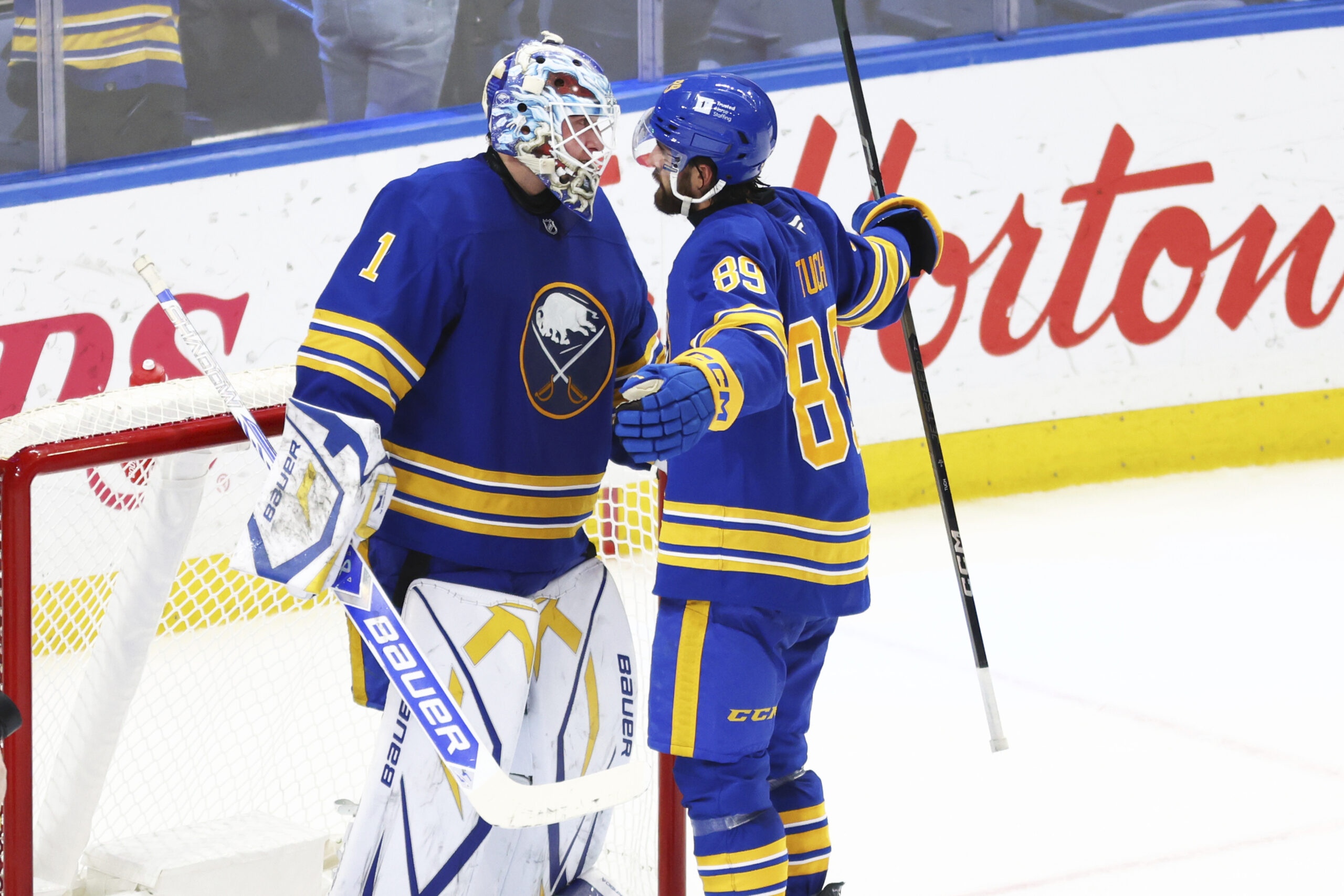 Buffalo Sabres goaltender Ukko-Pekka Luukkonen (1) and right wing Alex...