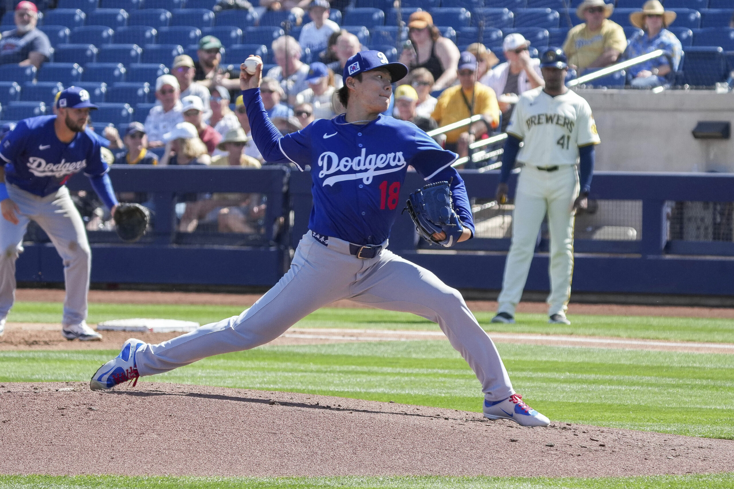 Dodgers pitcher Yoshinobu Yamamoto throws during the first inning of...