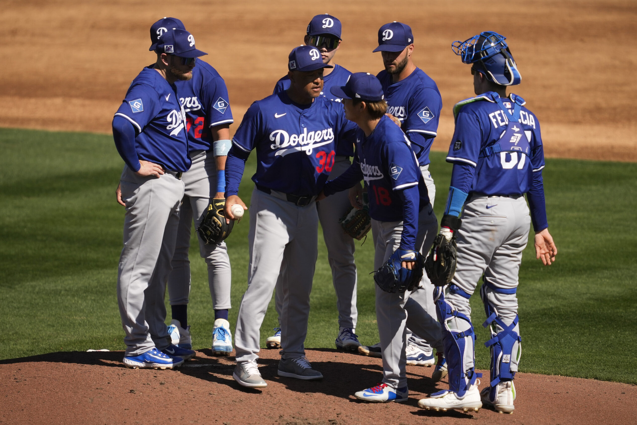 Dodgers starting pitcher Yoshinobu Yamamoto leaves the mound during the...