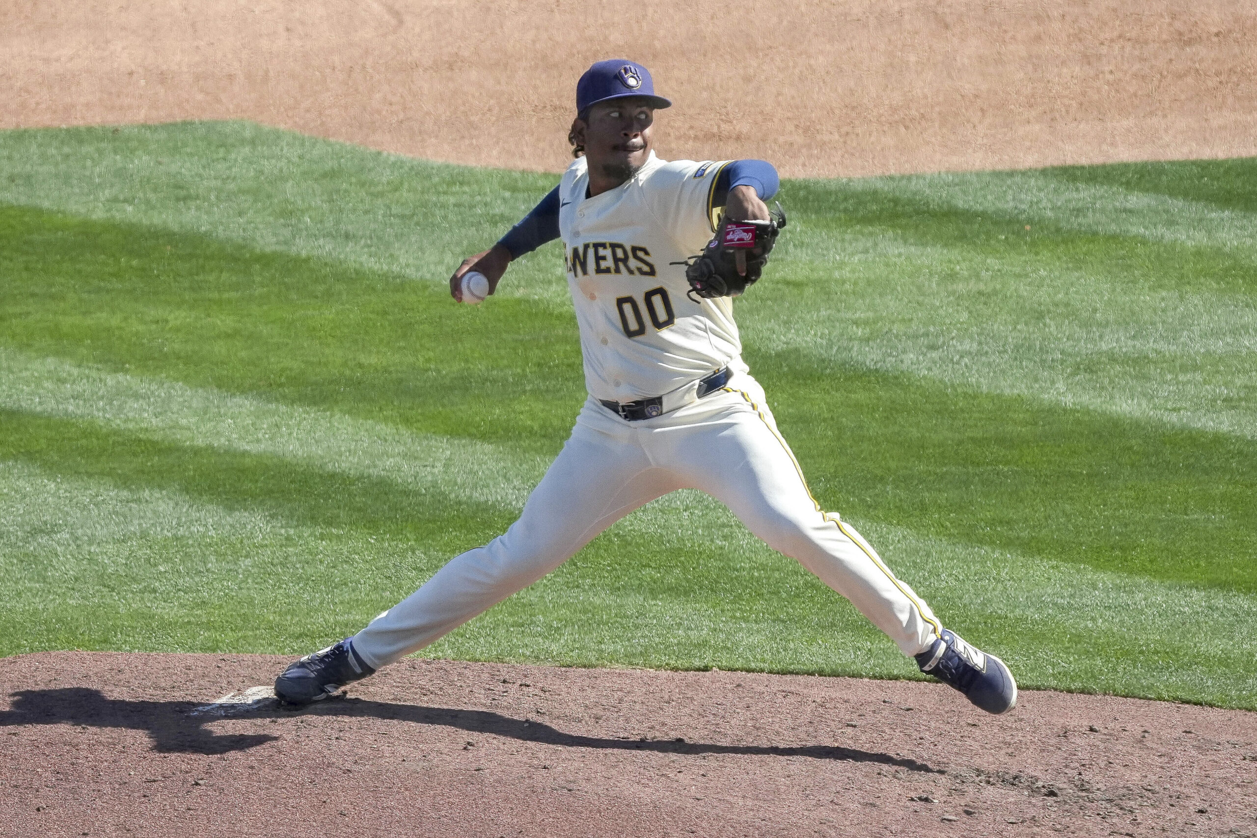 Milwaukee Brewers pitcher Carlos Rodriguez throws during the third inning...