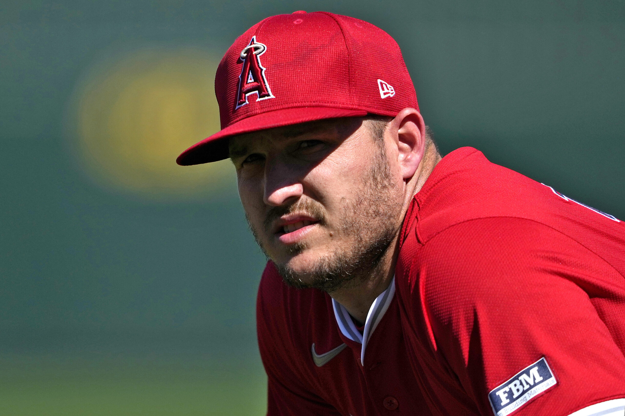 Angels star Mike Trout looks on during a Cactus League...