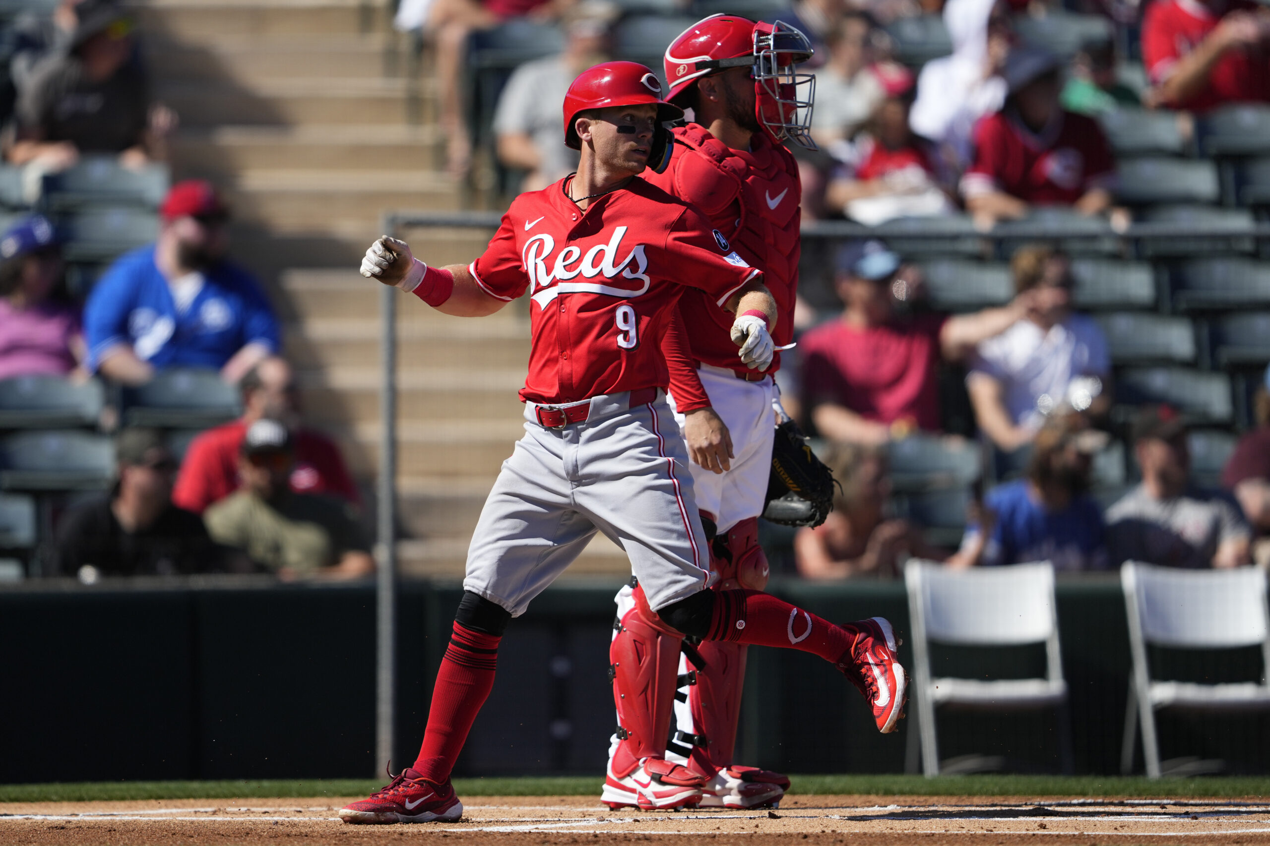 The Cincinnati Reds’ Matt McLain scores on a triple hit...