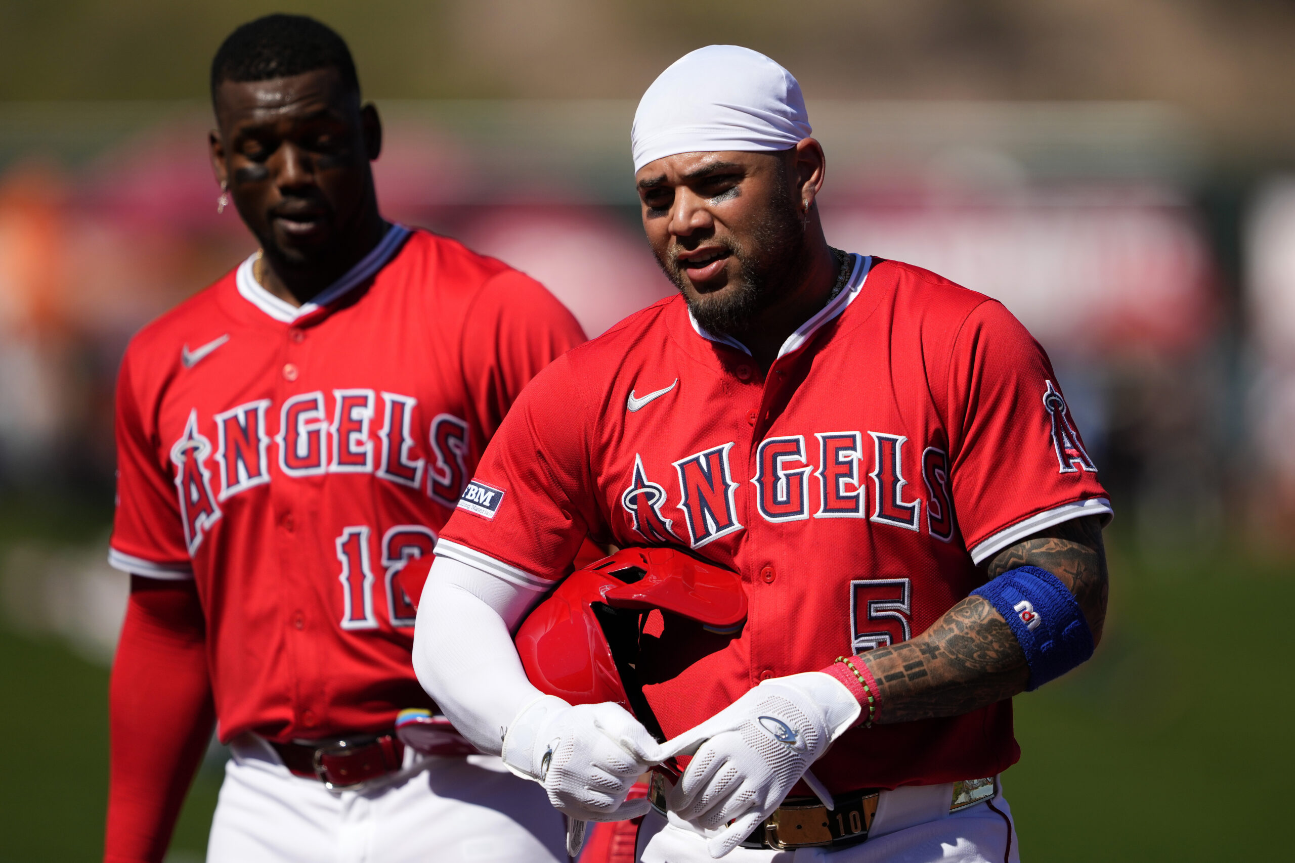 The Angels’ Yoan Moncada, right, and Jorge Soler walk to...