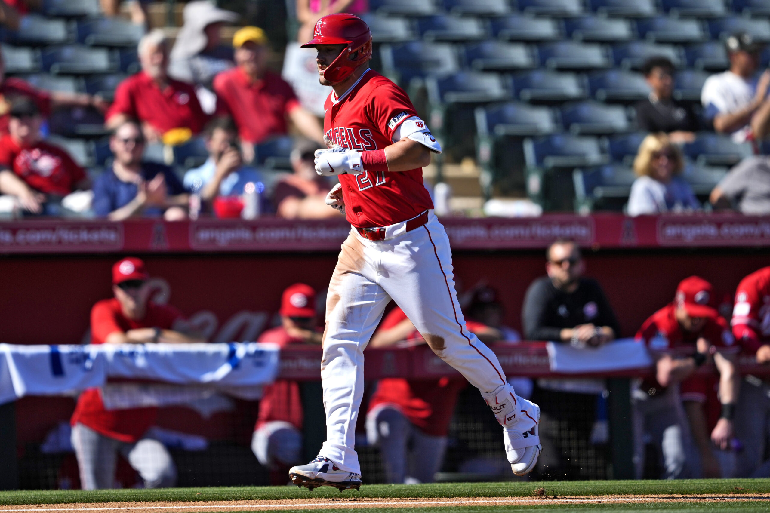 Angels star Mike Trout rounds the bases after hitting a...